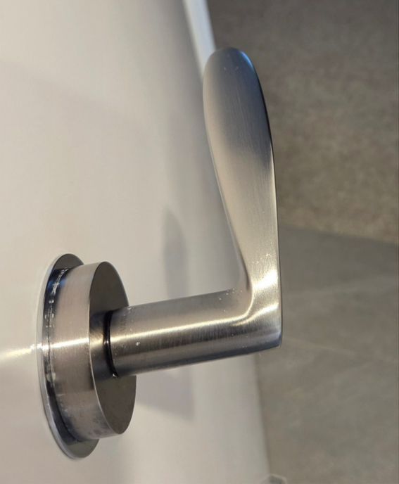 A Dirty Door Handle on a White Door — KirraLina Cleaning Services in Tweed Heads, NSW