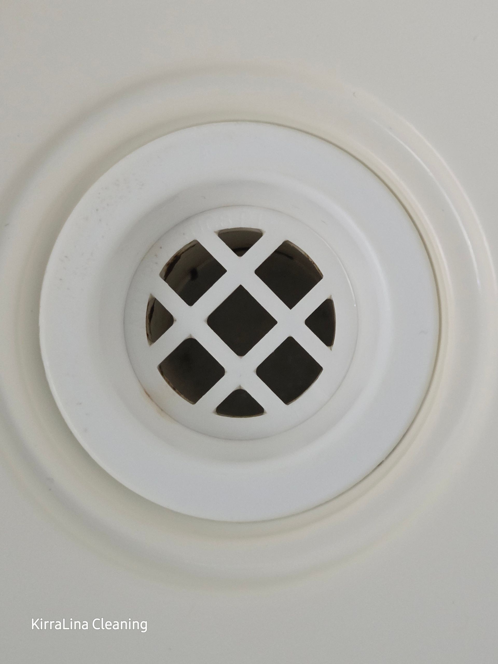 After: White Circular Drain in a White Surface, With a Diamond-patterned Vent Cover — KirraLina Cleaning Services in Kingscliff, NSW