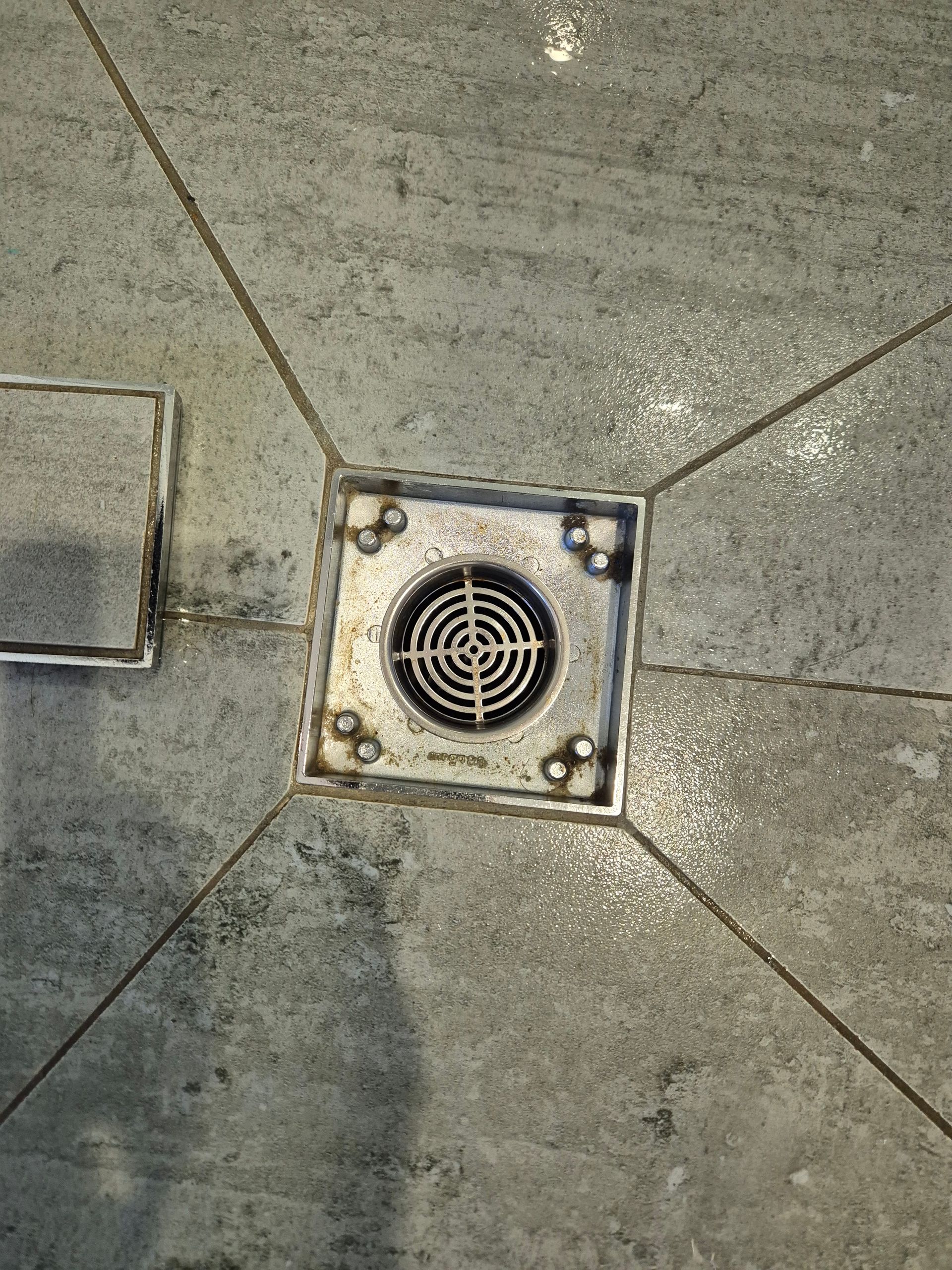 After: Square Metal Drain in a Tiled Floor, Surrounded by Grout Lines — KirraLina Cleaning Services in Burleigh Heads, QLD