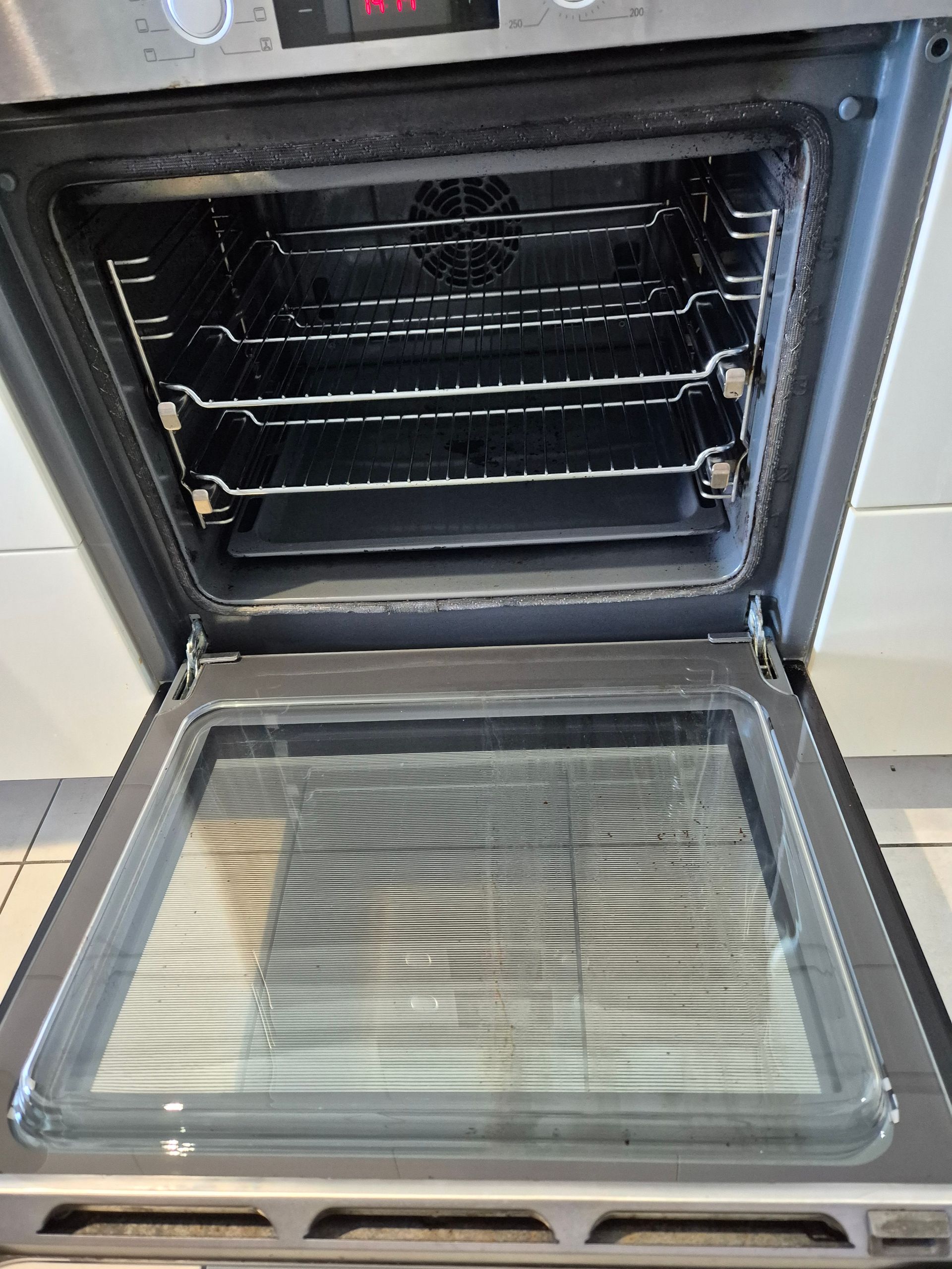 After: Oven Door Open, Revealing the Interior Racks and Glass Door — KirraLina Cleaning Services in Casuarina, NSW