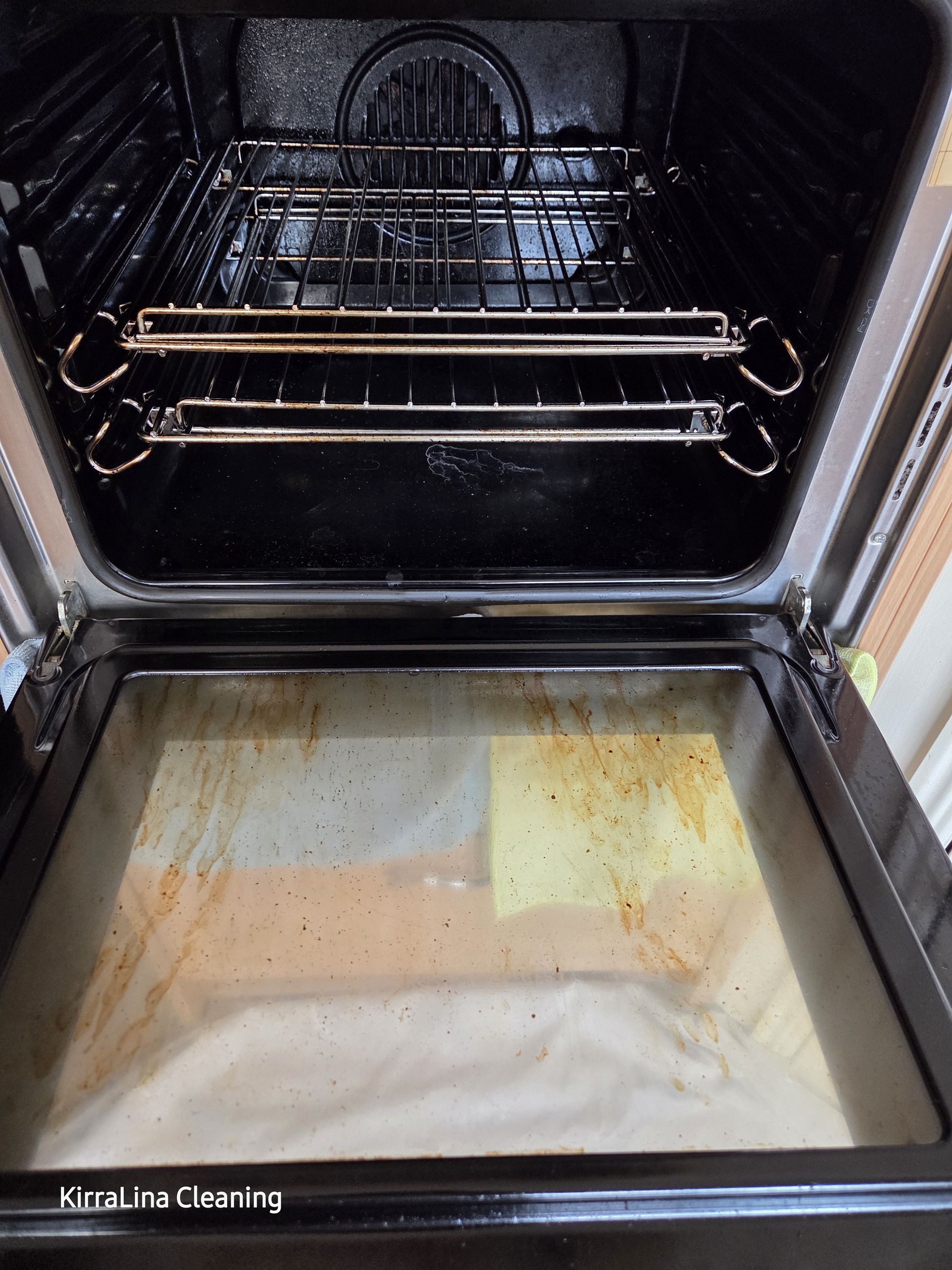 Open oven with dirty interior and stained bottom tray — KirraLina Cleaning Services in Tweed Heads, NSW