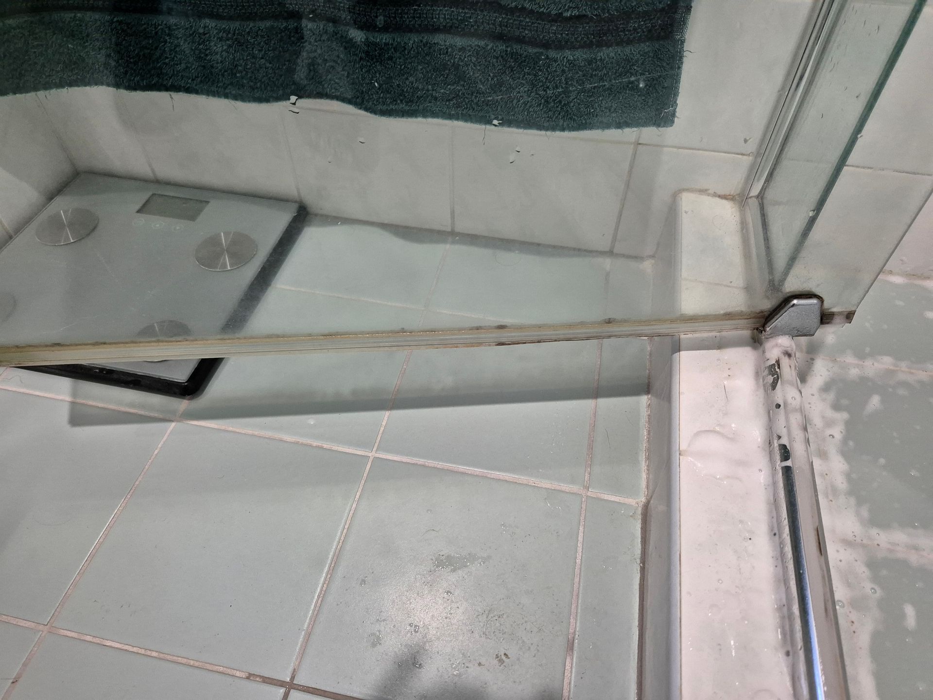 Before: Shower Door With a Build-up of Mold and Grime at Its Base — KirraLina Cleaning Services in Kingscliff, NSW