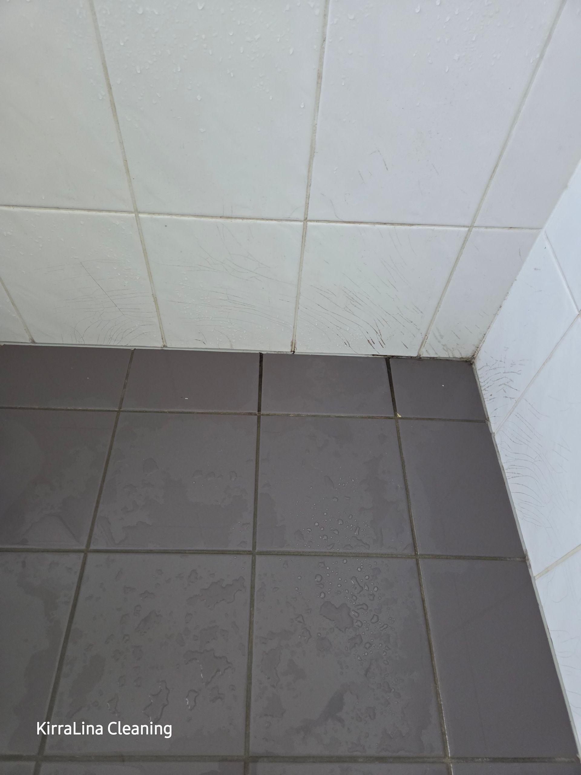 Before: Dark Grey Tiled Floor Meets White Tiled Wall in a Corner — KirraLina Cleaning Services in Palm Beach, NSW