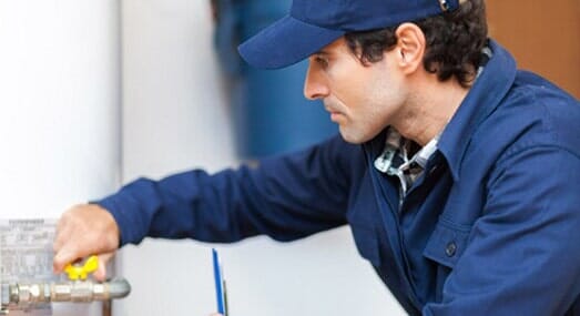 Plumber Repairing Heater — Plumbing and Heating Service in Stamford, CT