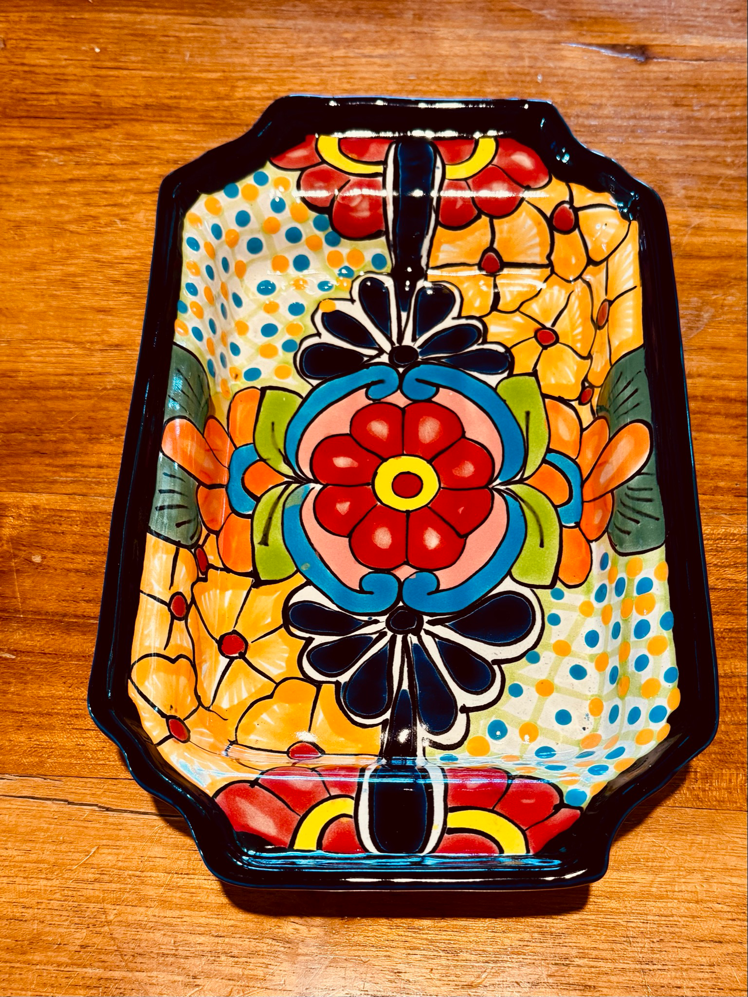 Colourful, Floral, Ceramic Dish With Black Trim, on a Wooden Surface — Mexican Homewares Australia in Burleigh Heads, QLD