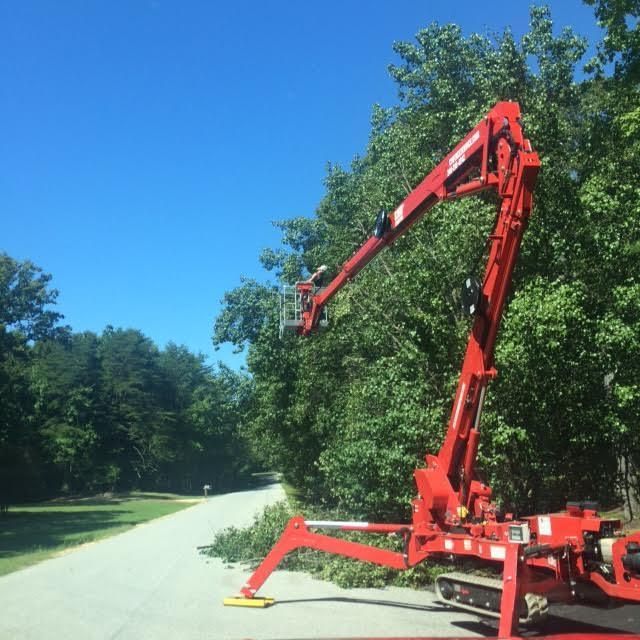 A red crane is parked on the side of a road