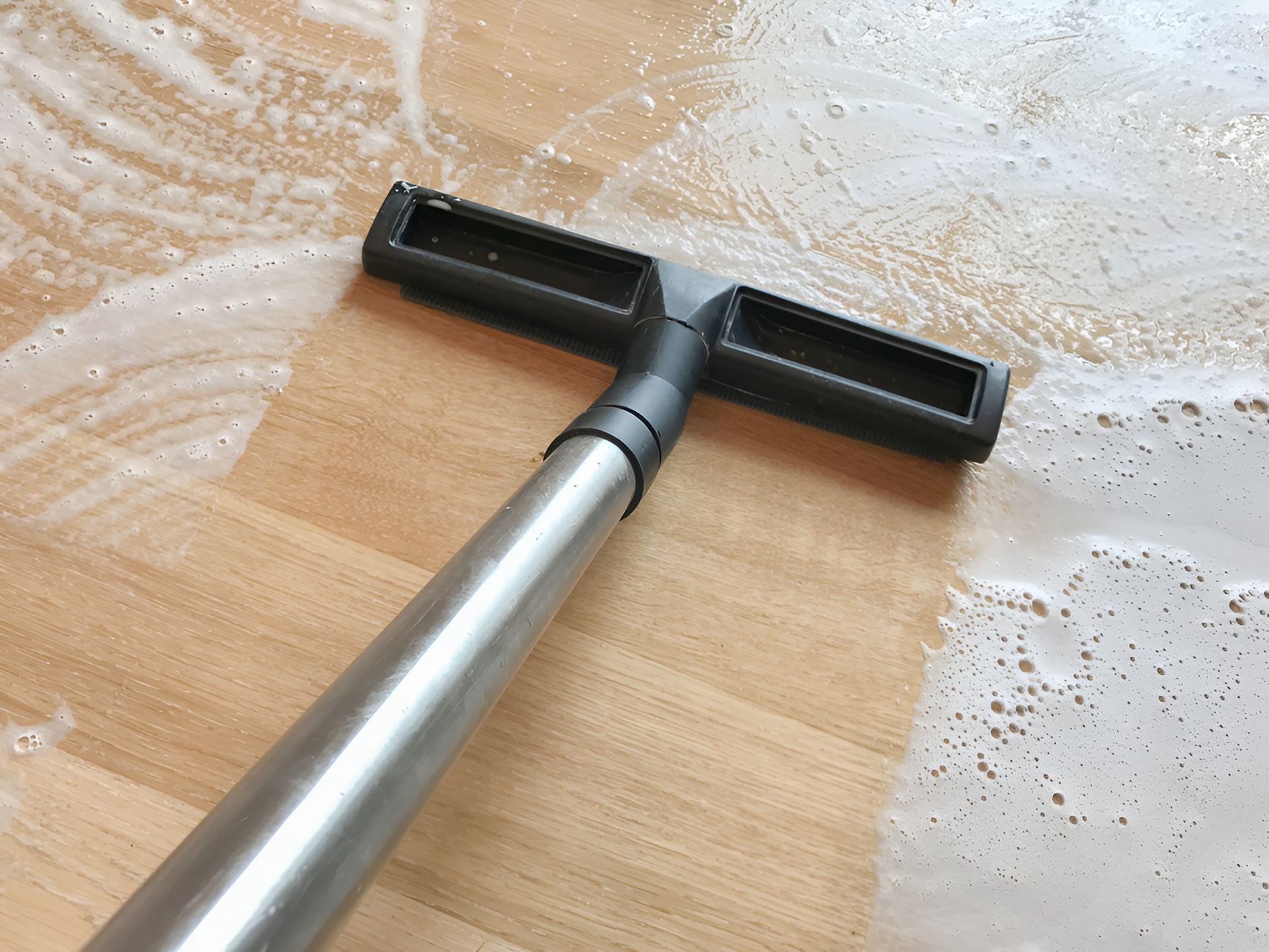 Vacuum Cleaner Head Cleaning a Wooden Floor — Cairns Local Cleaning Services in Woree, QLD