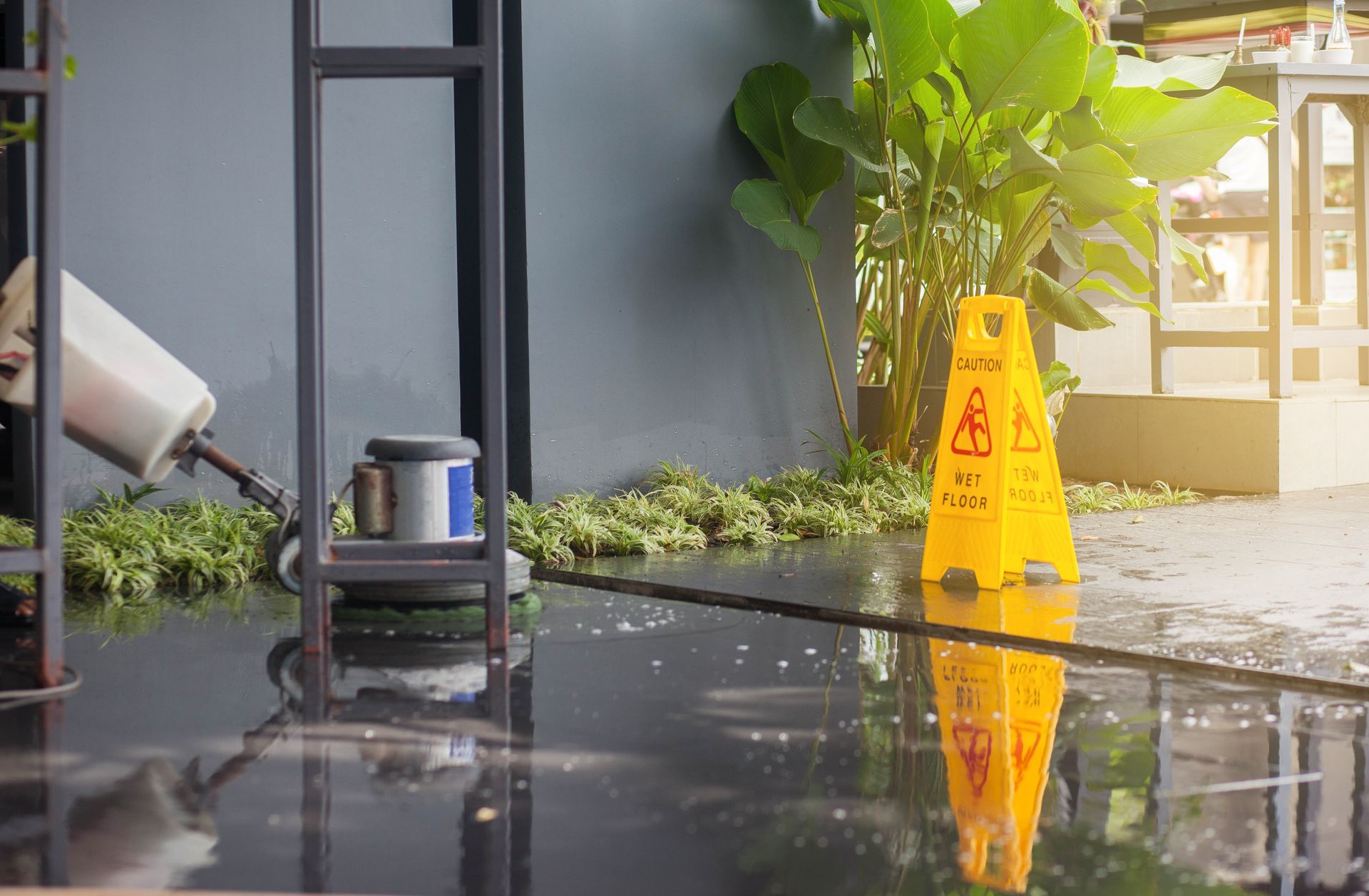 Wet Floor Being Cleaned With a Machine— Cairns Local Cleaning Services in Woree, QLD