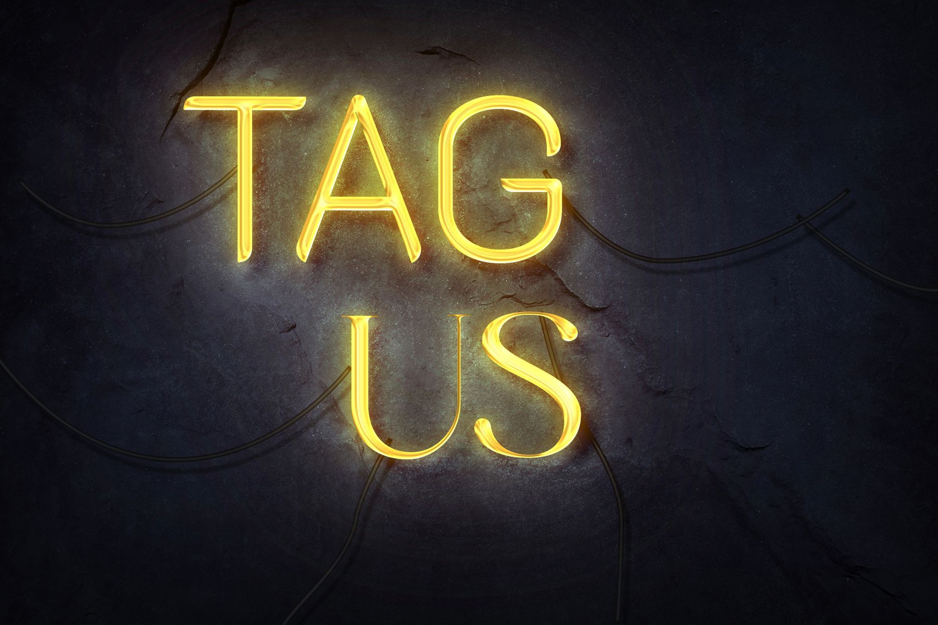 A bright neon sign with the phrase “Tag Us” glowing against a dark background A bright neon sign with the phrase “Tag Us” glowing against a dark background
