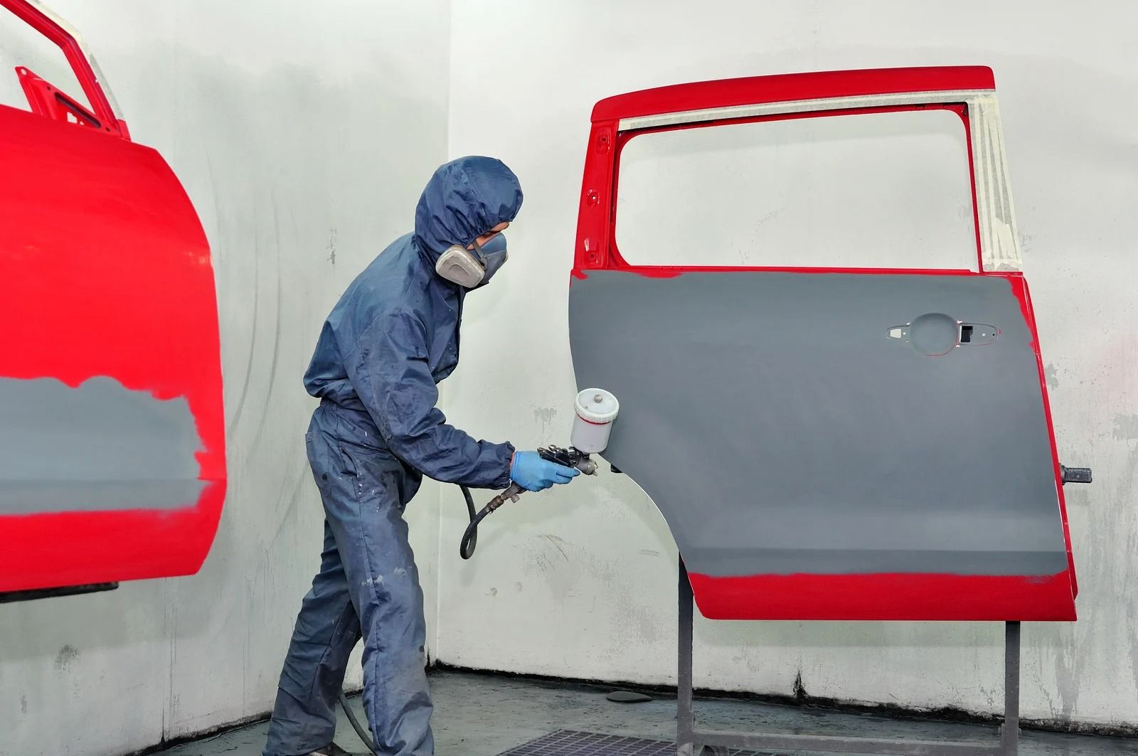 Man painting car door