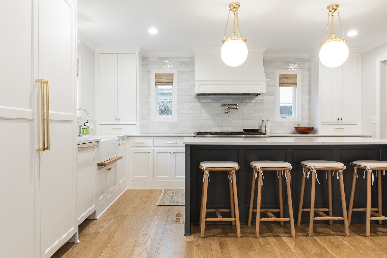 A kitchen with black cabinets