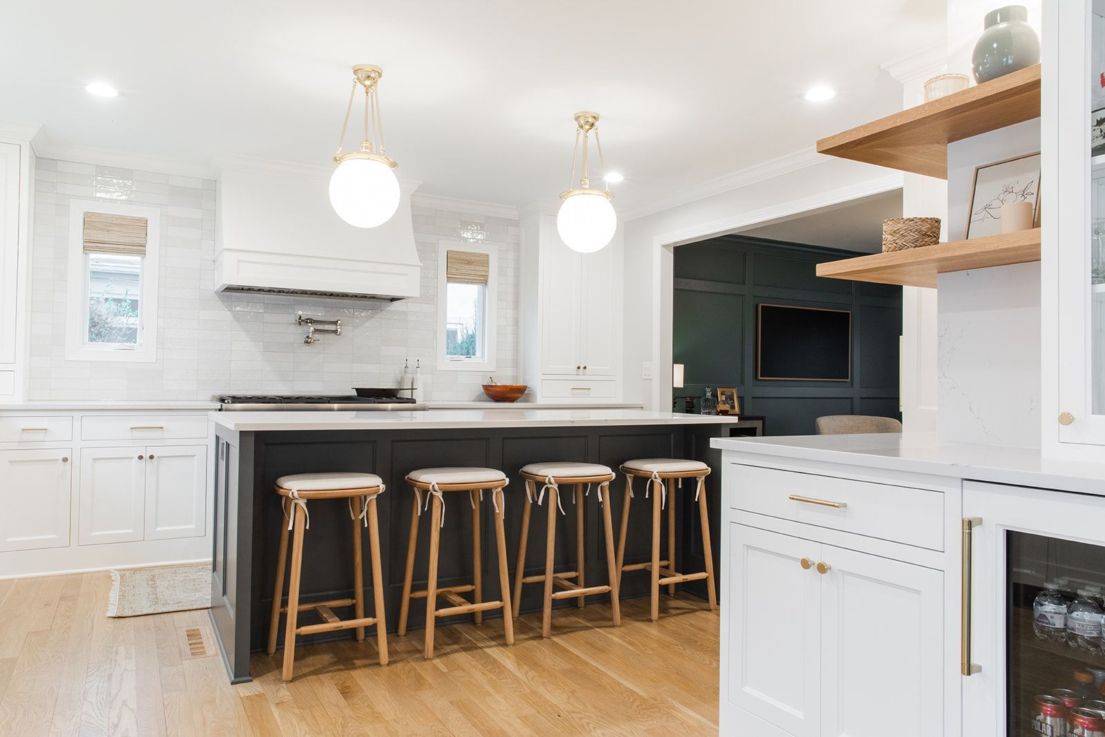 A kitchen with white cabinets