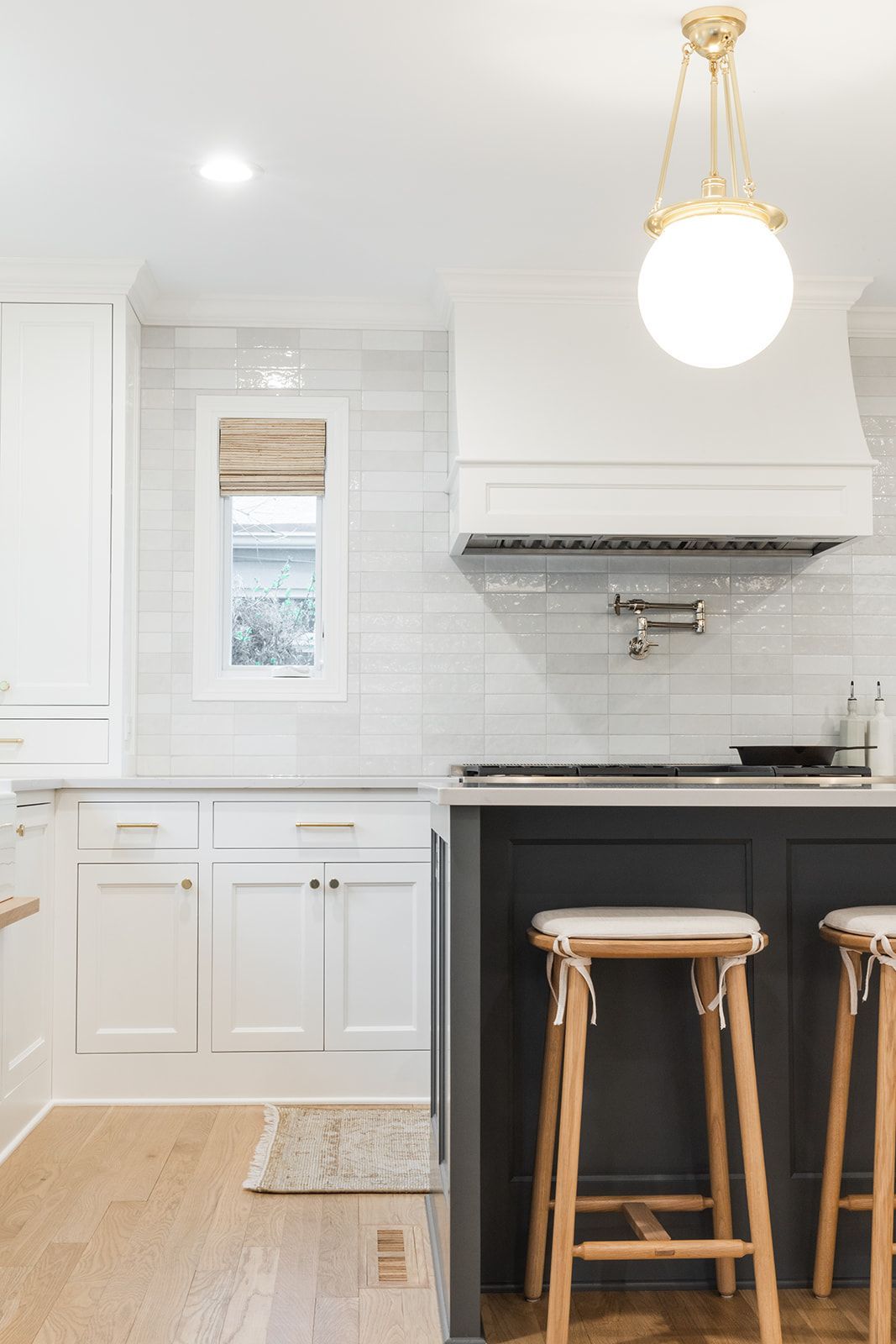 A kitchen with white cabinets