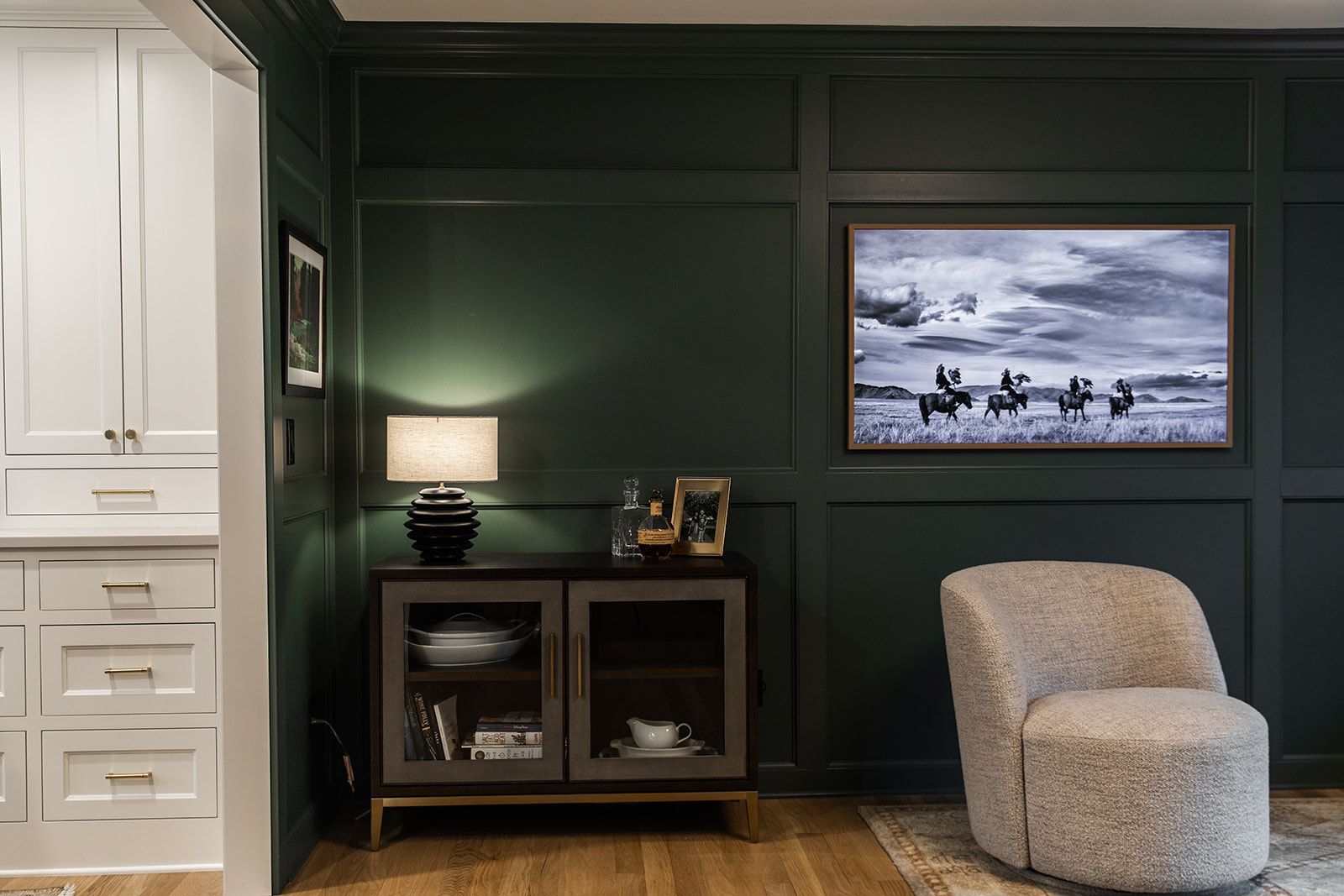 A living room with dark green walls 