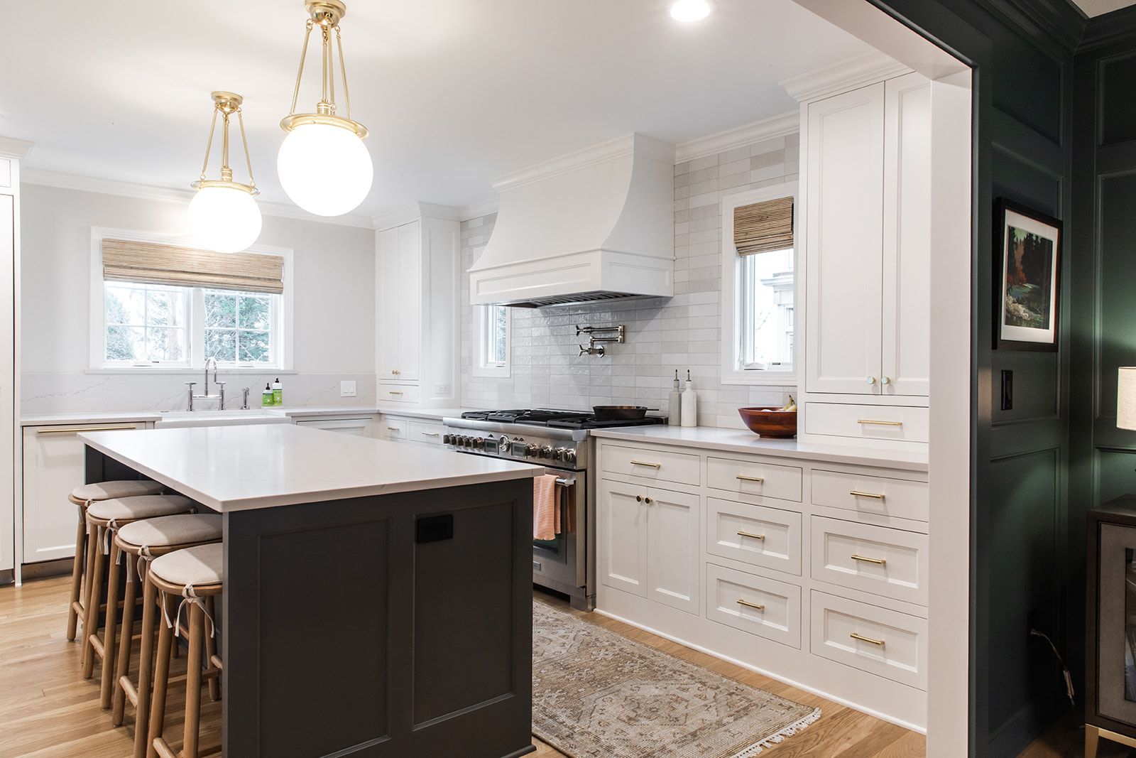 A kitchen with a large island and a stove
