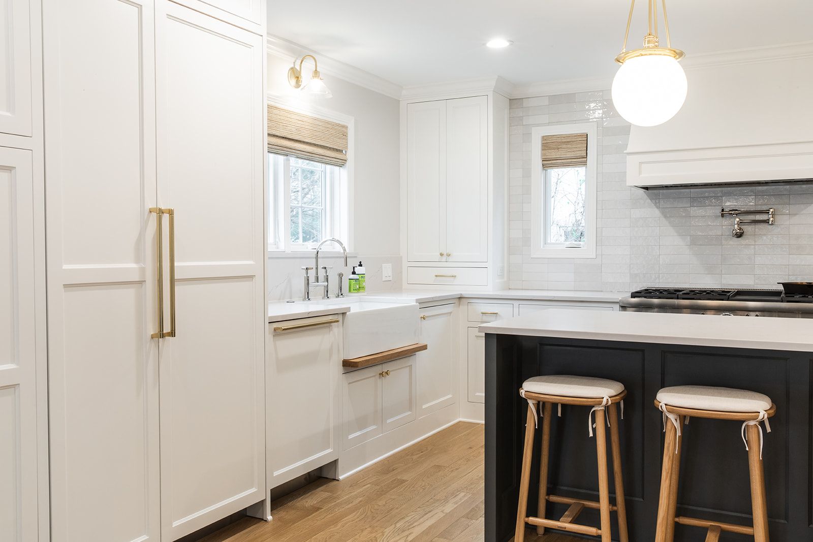 A kitchen with black island