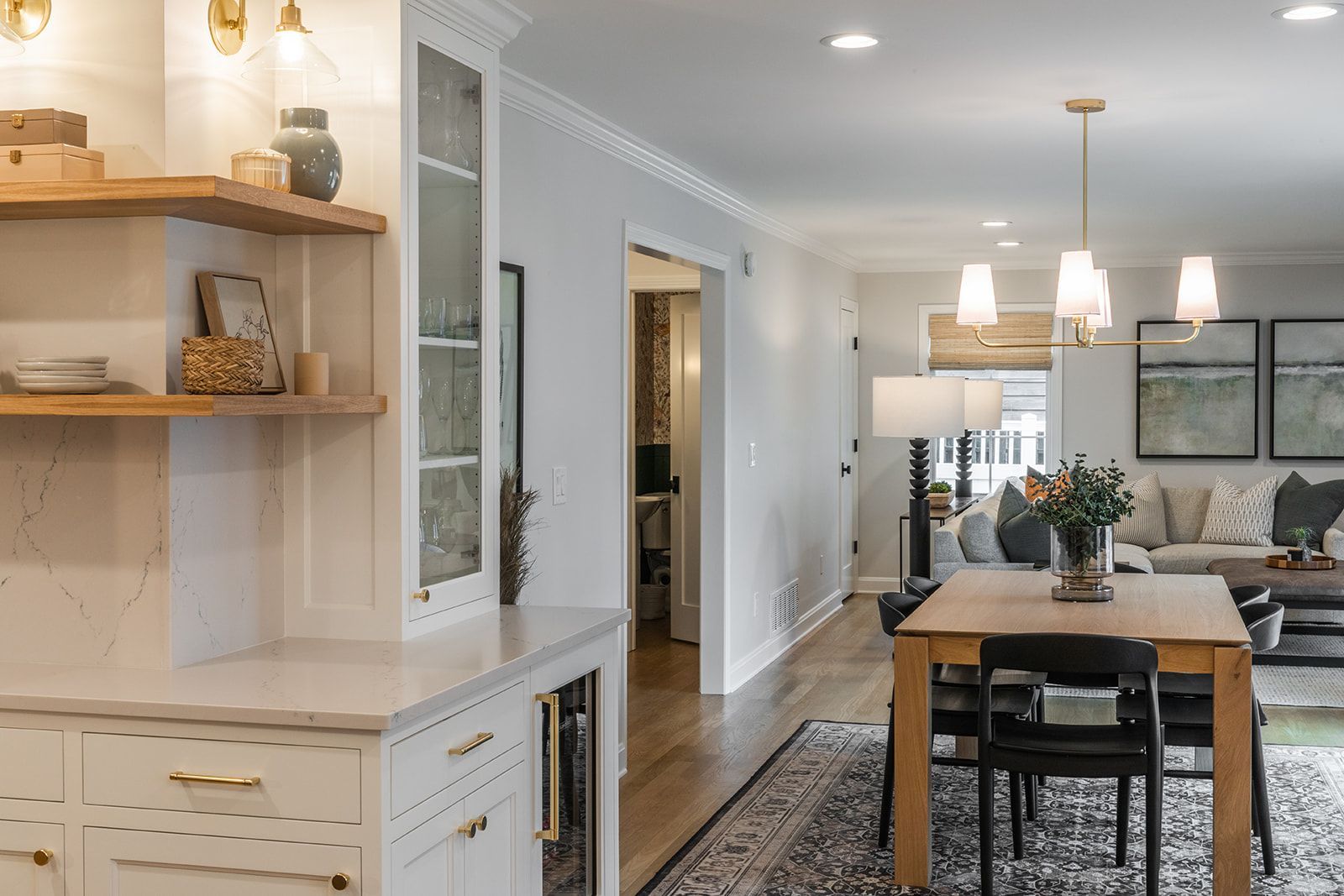 A living room with a table and chairs 
