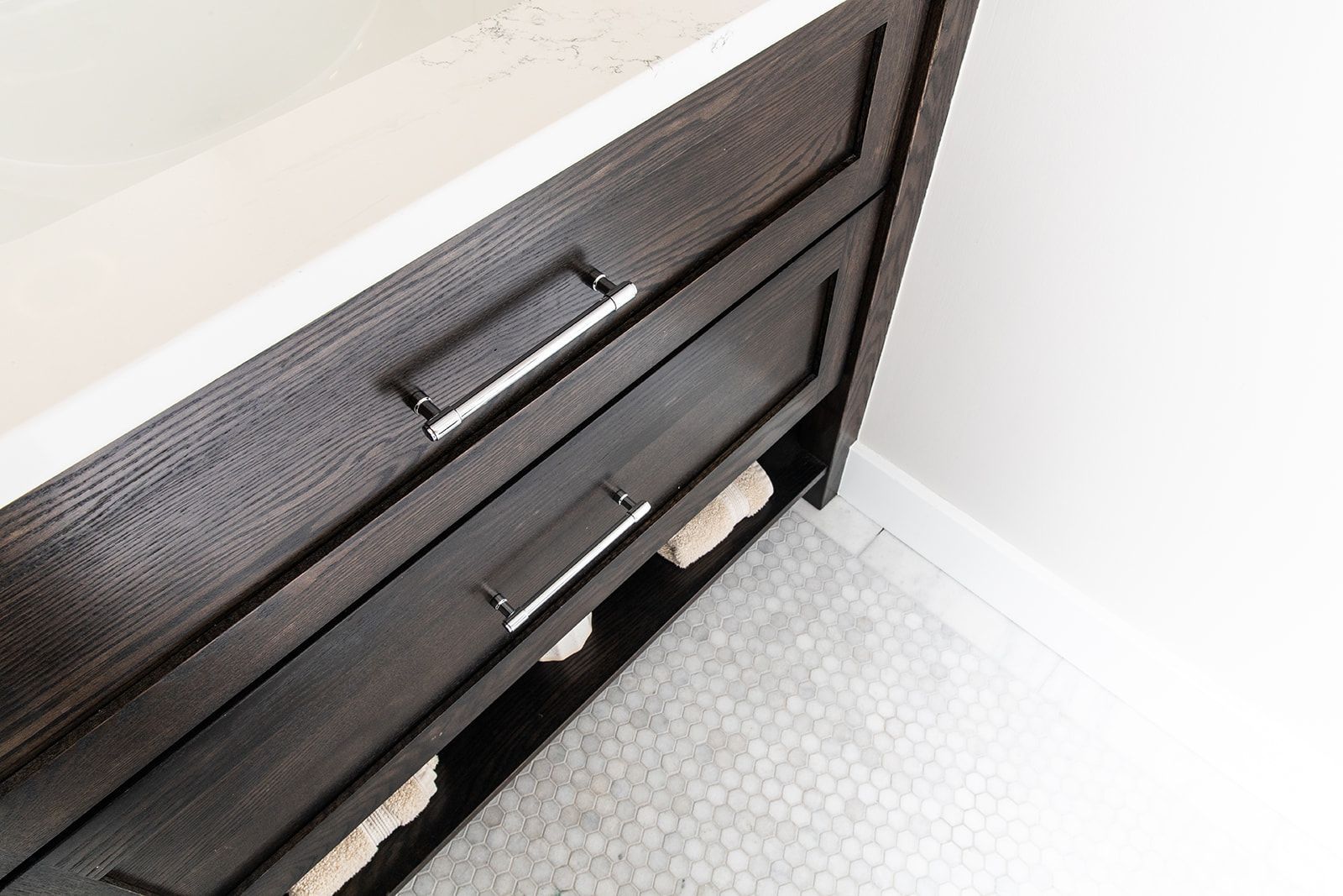 A bathroom vanity with two drawers and a sink