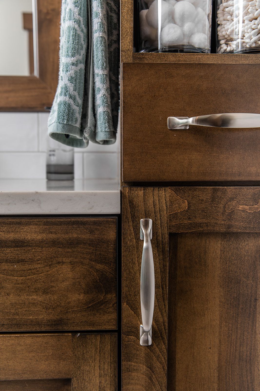 A bathroom with wooden cabinets