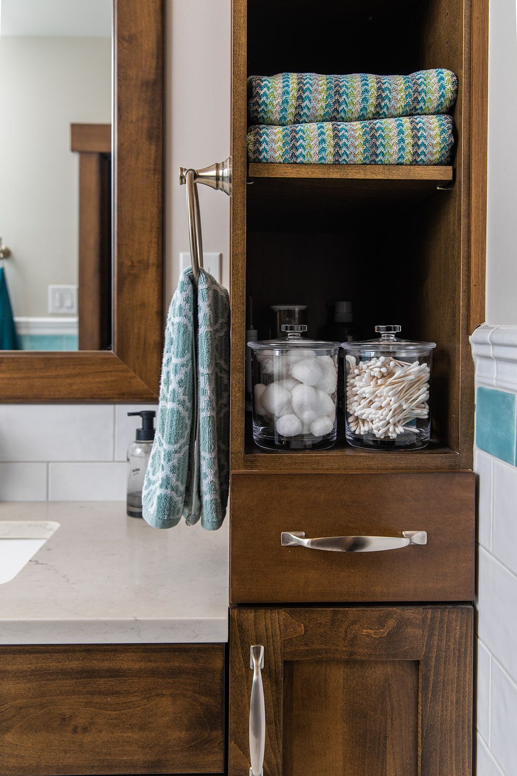 A bathroom with a wooden cabinet