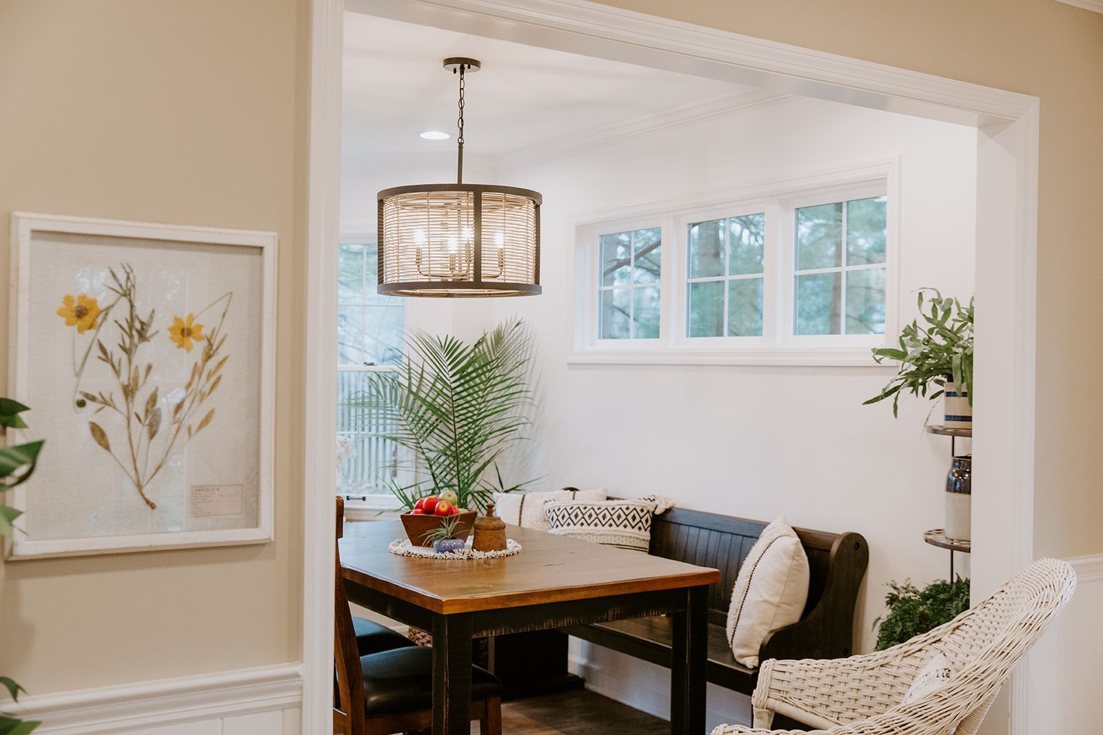 A dining room with a table and chairs