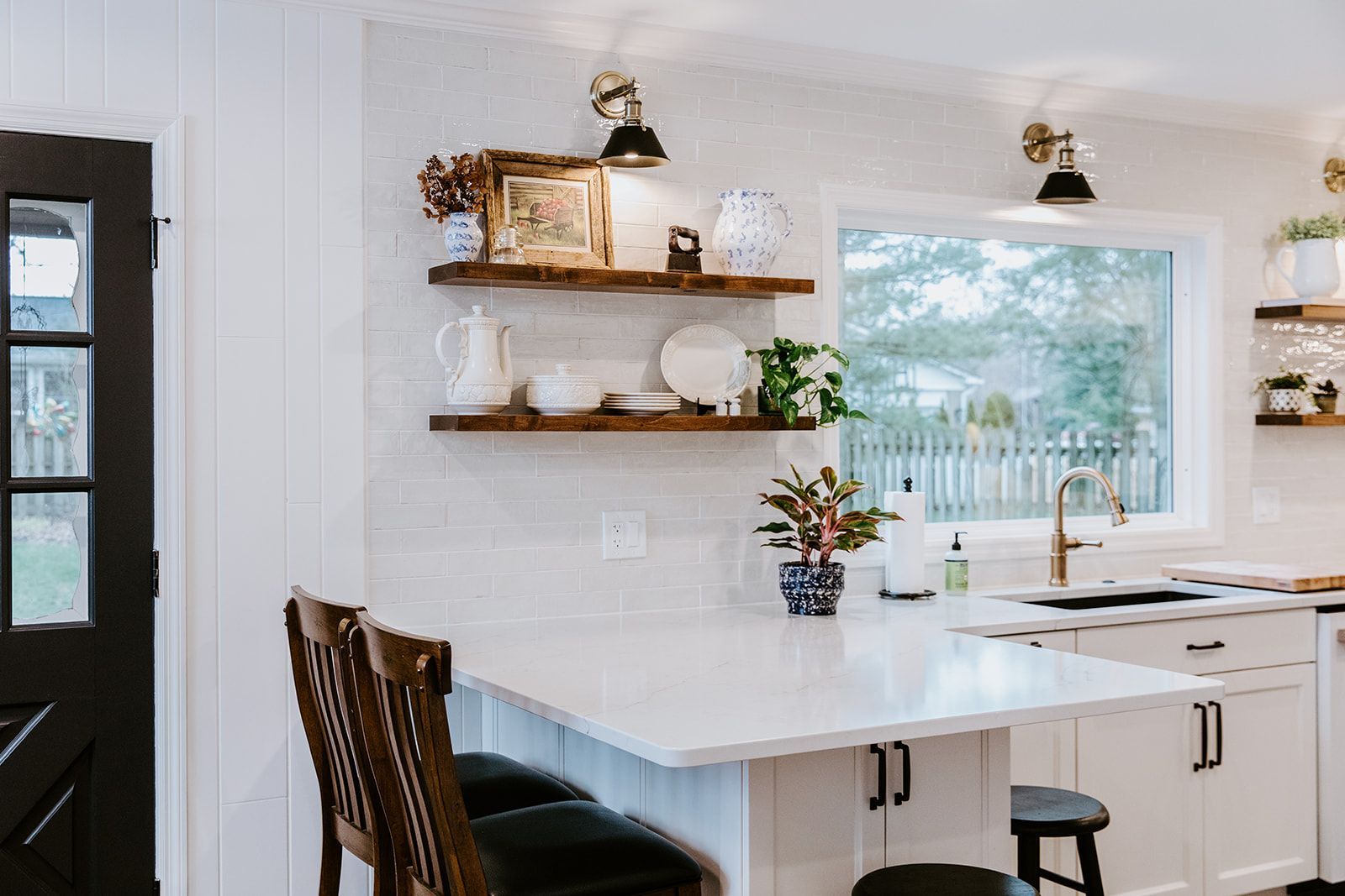 A kitchen with white cabinets