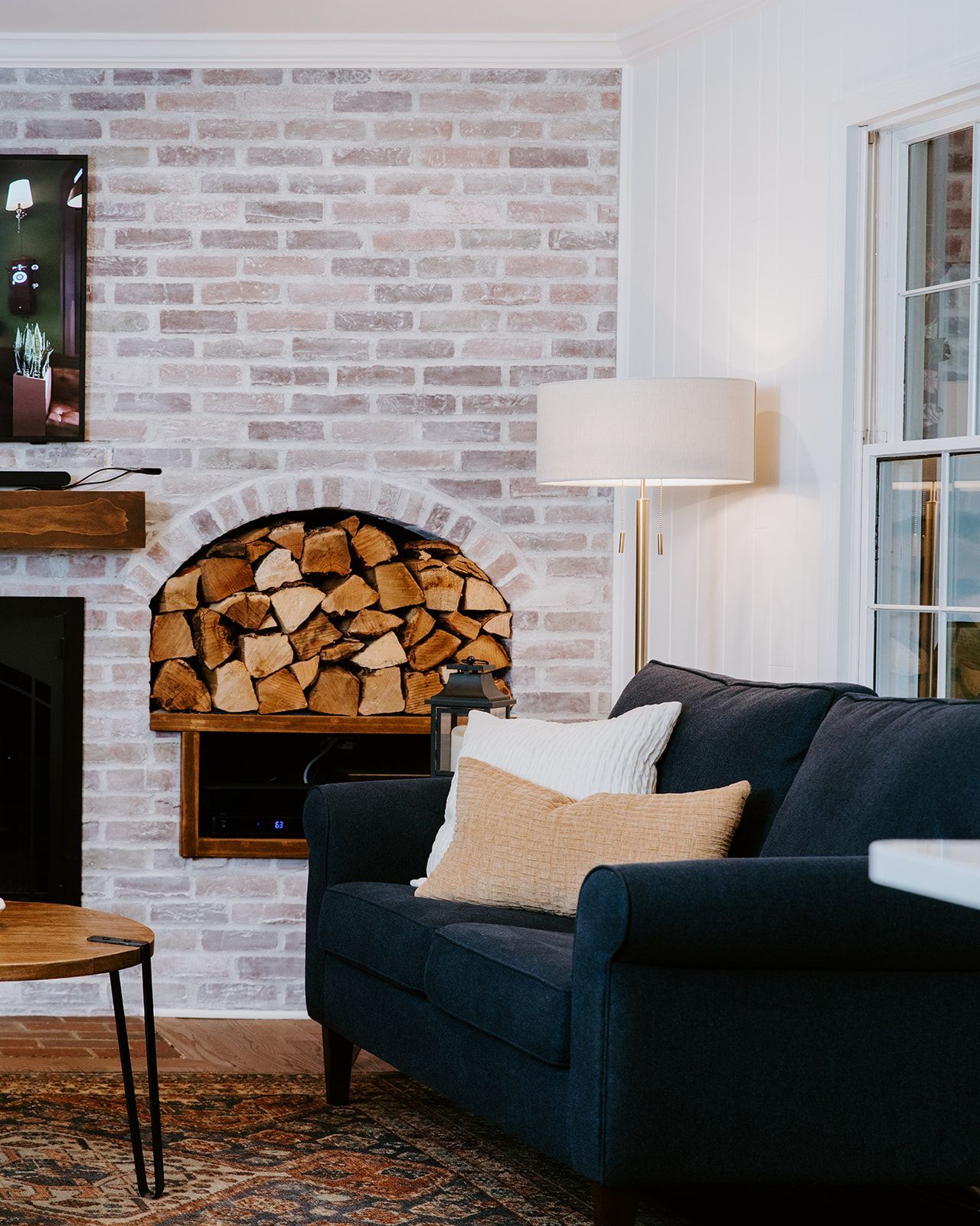 A living room with a fireplace and a couch