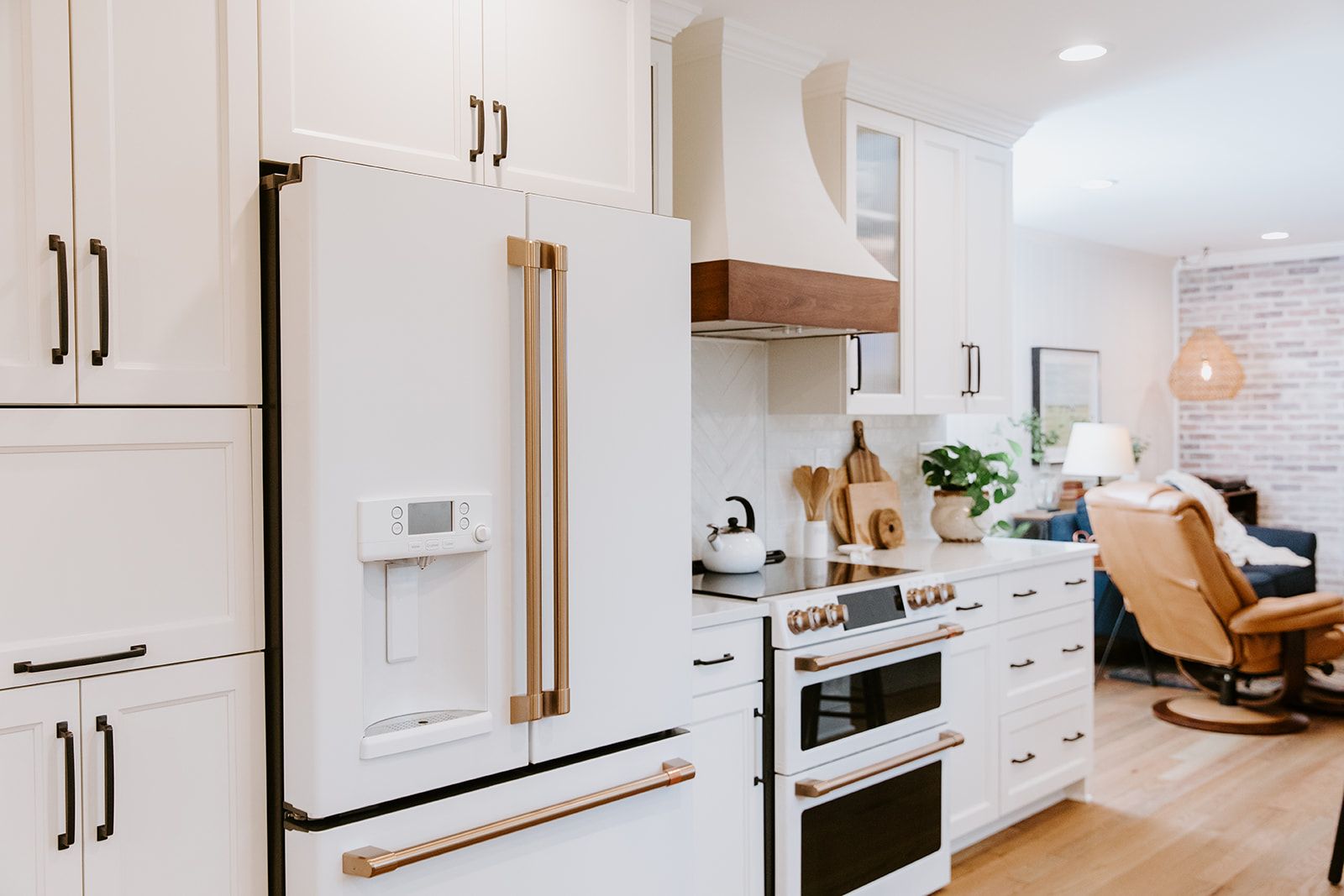 A kitchen with white cabinets
