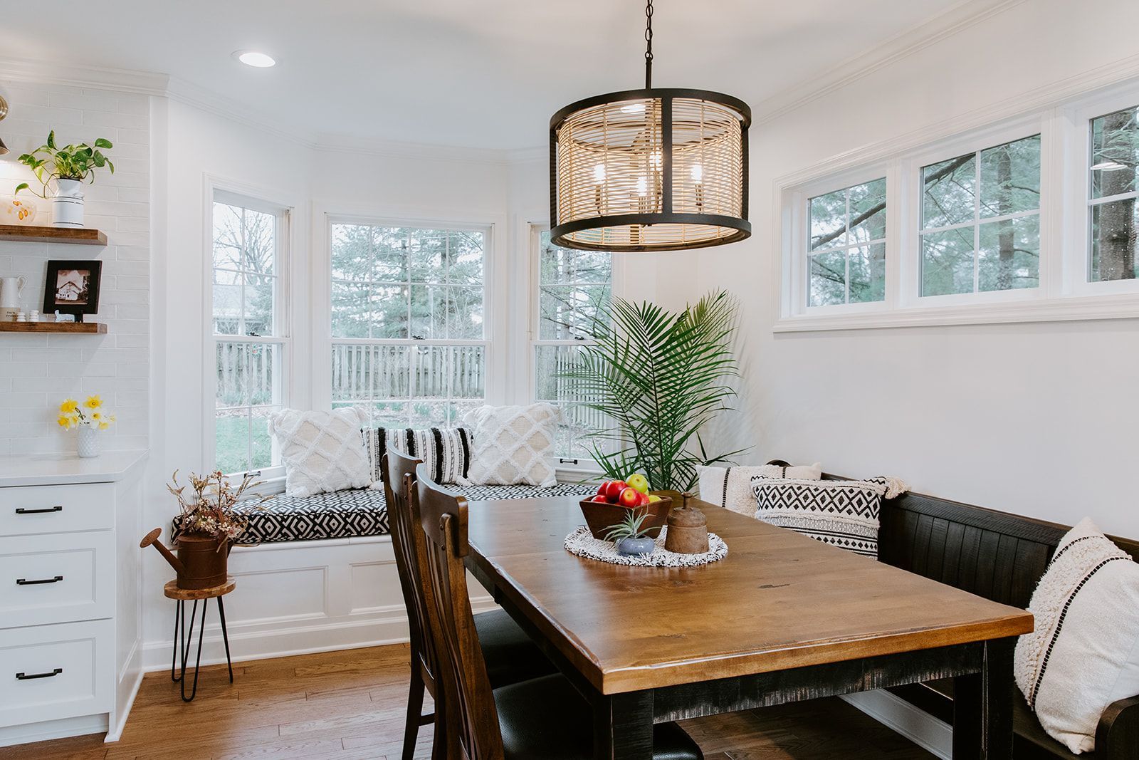 A dining room with a wooden table 