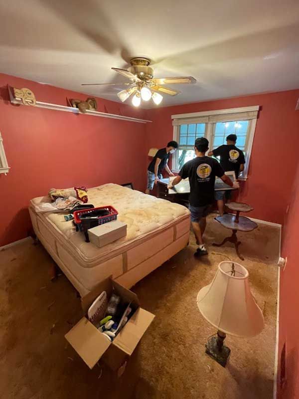 a yellow truck full of trash