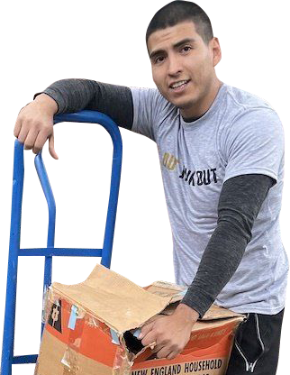 a man is leaning on a hand truck while holding a cardboard box .