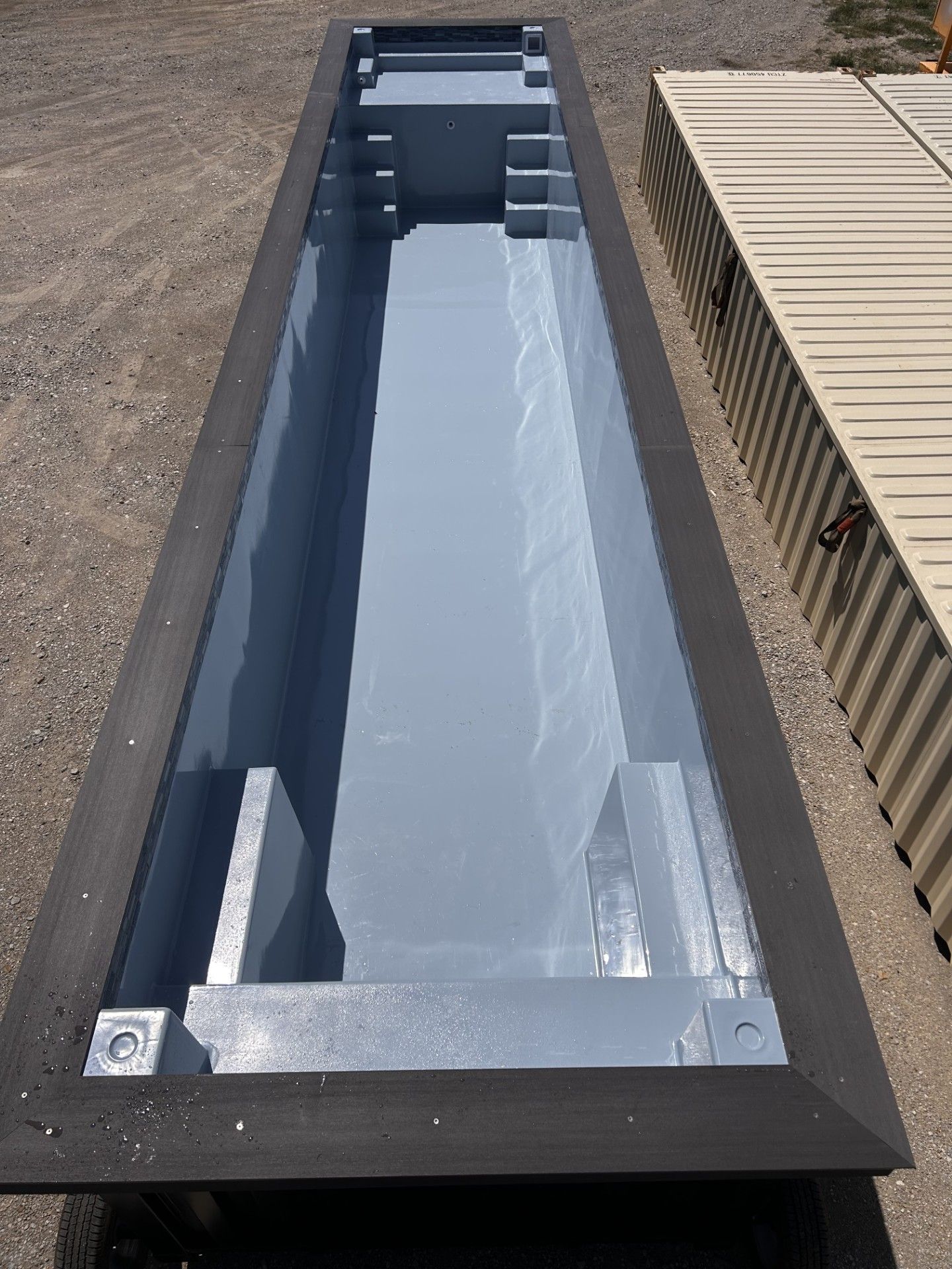 A large metal container is sitting inside of a building.