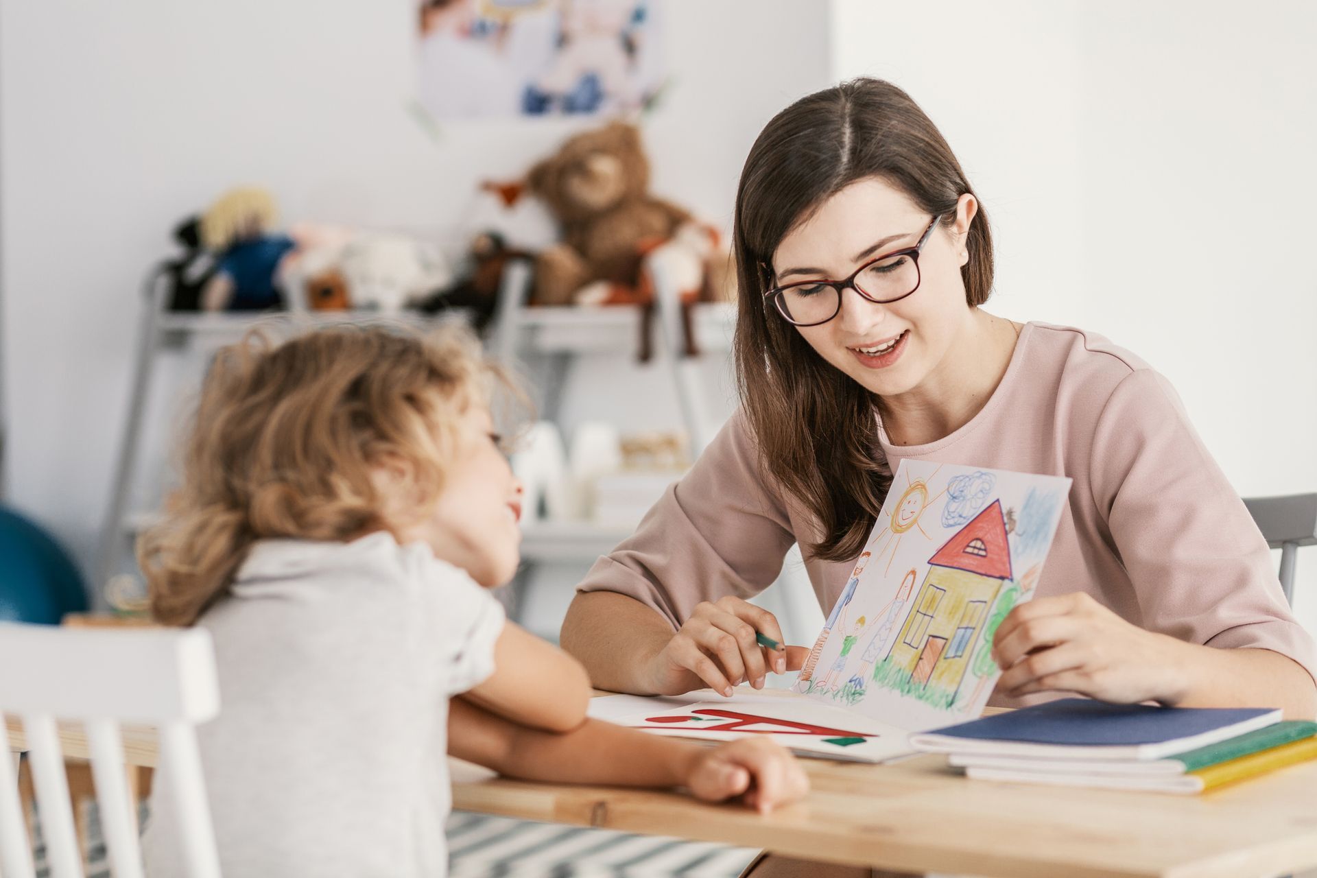 A professional child education therapist having an In-Home Behavioural Therapy Session