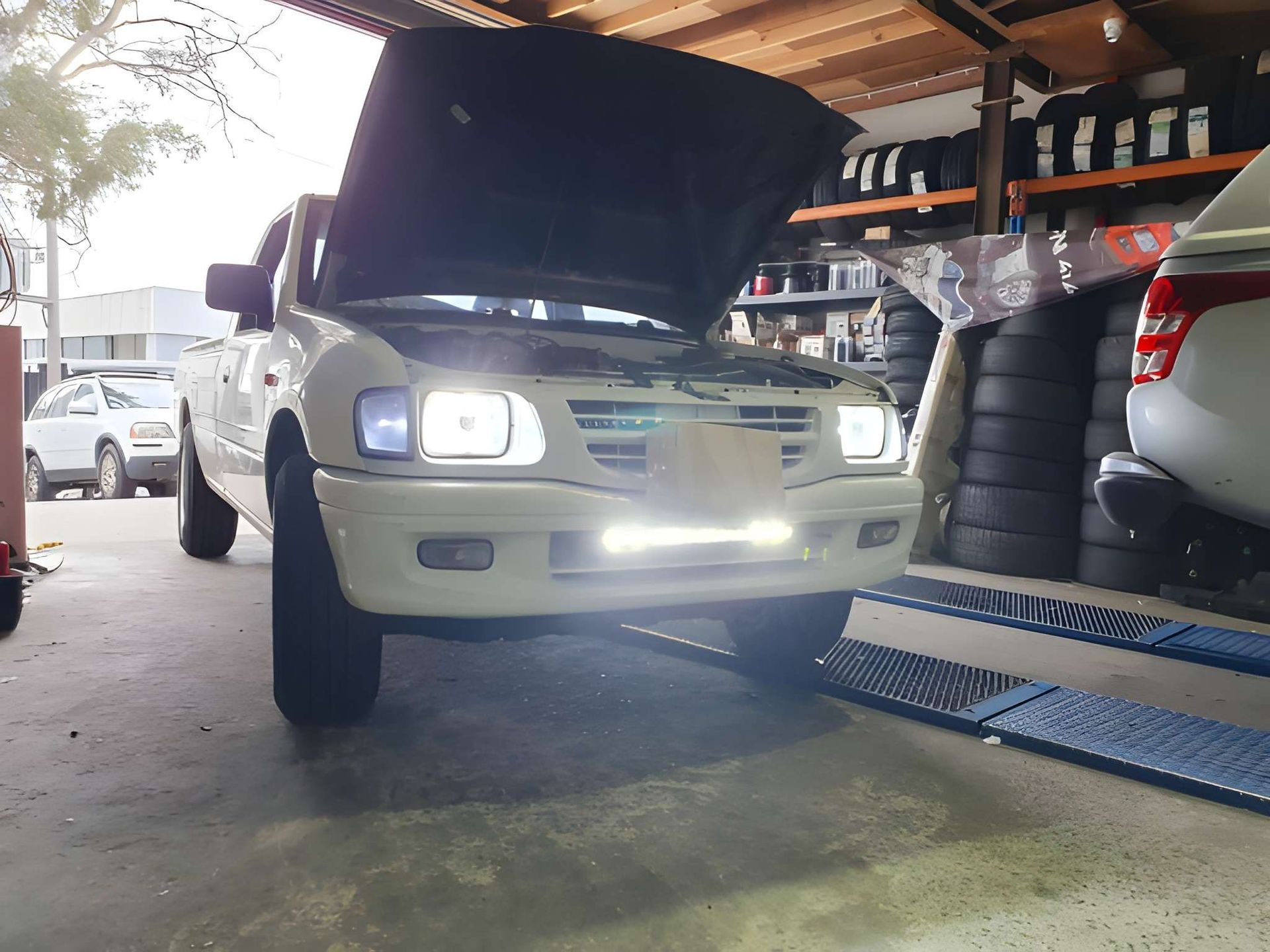 White Pickup Truck With Hood Open, Under Repair at a Garage — Mechanical Care in Belconnen, ACT
