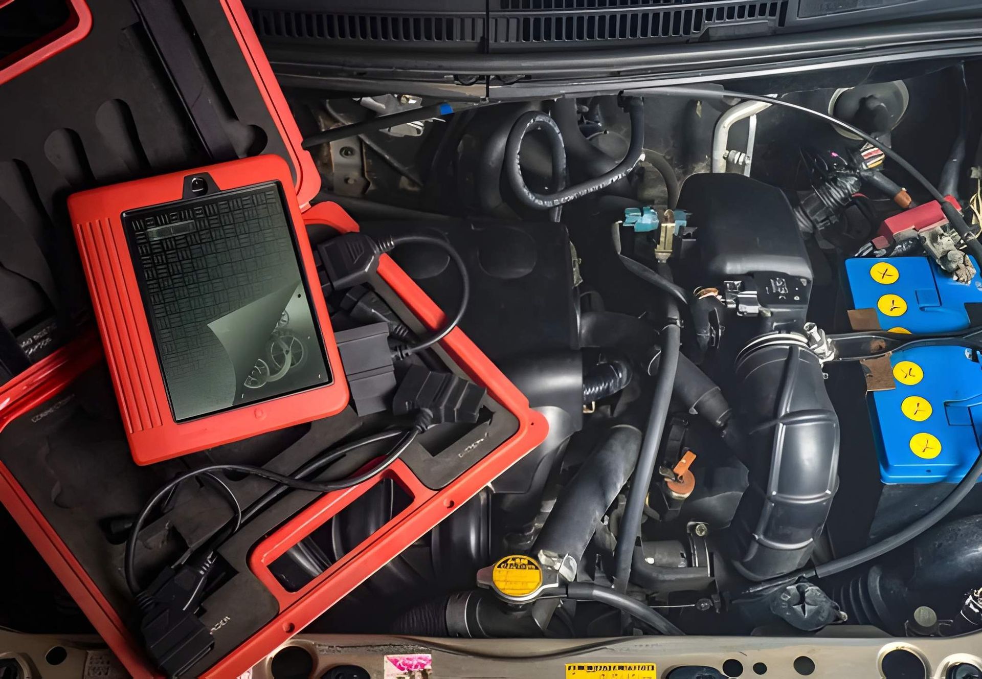 Diagnostic Tool Kit Open in a Car Engine Bay — Mechanical Care in Belconnen, ACT