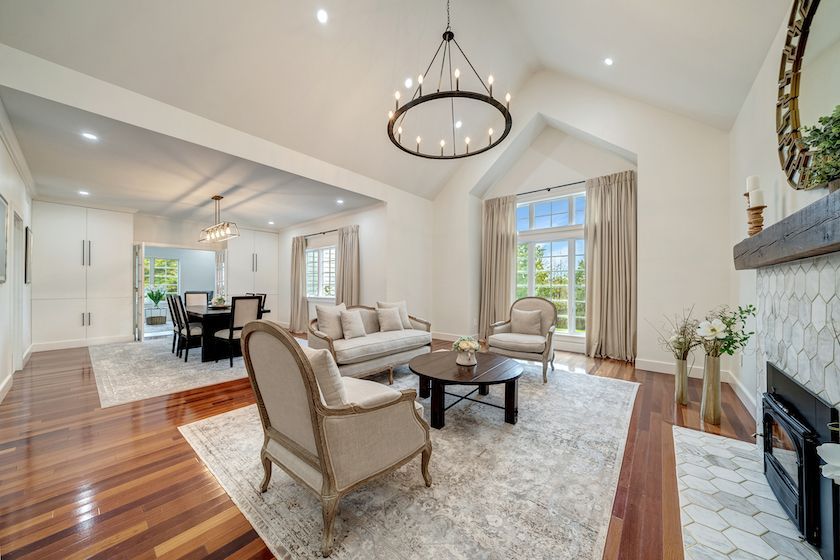 A living room filled with furniture and a fireplace.