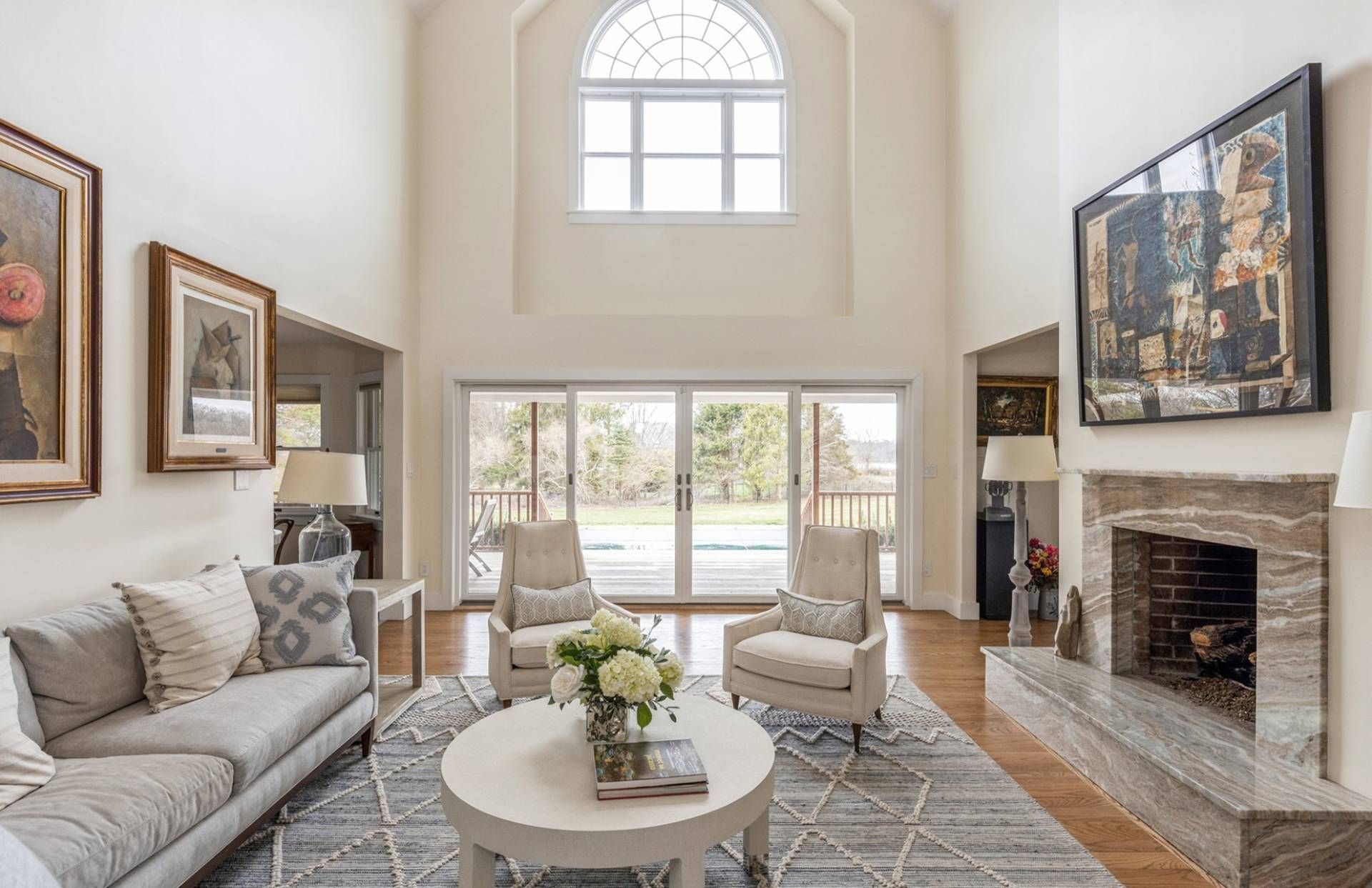 A living room filled with furniture and a fireplace.