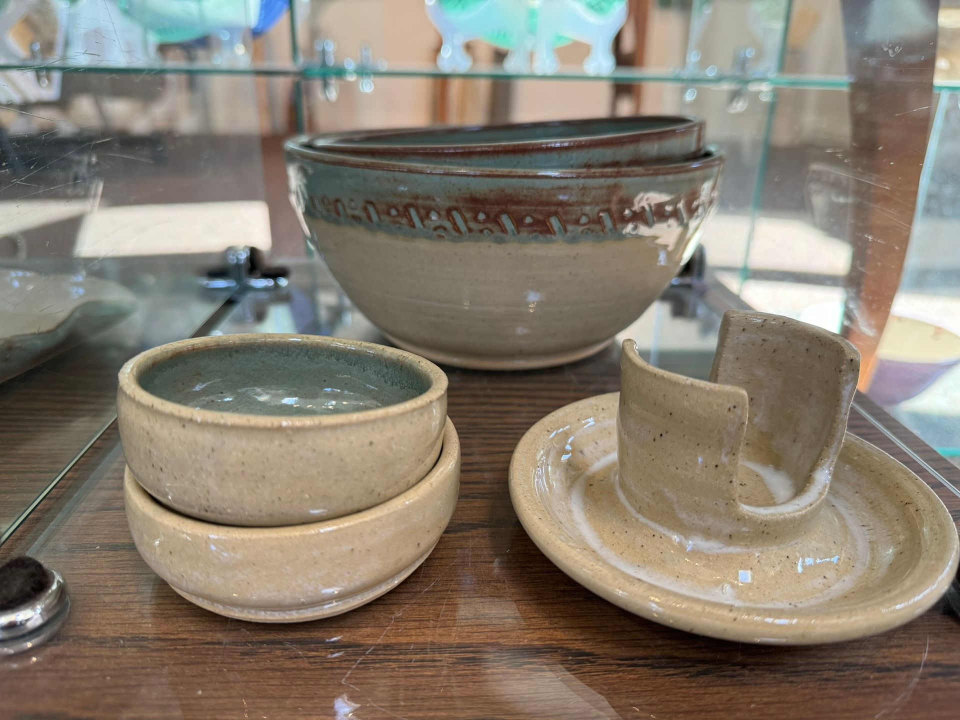 A display case filled with ceramic bowls and plates.