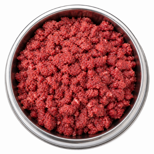 Top-down view of a metal dog bowl filled with ground beef