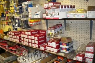 A store shelf filled with lots of boxes of various items