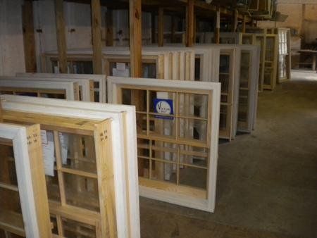 A warehouse filled with lots of wooden windows.