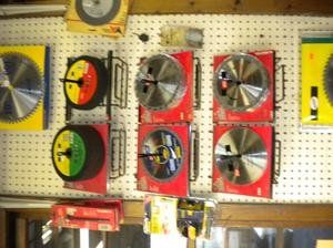 A bunch of circular saw blades hanging on a wall