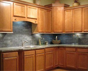 A kitchen with wooden cabinets and granite counter tops