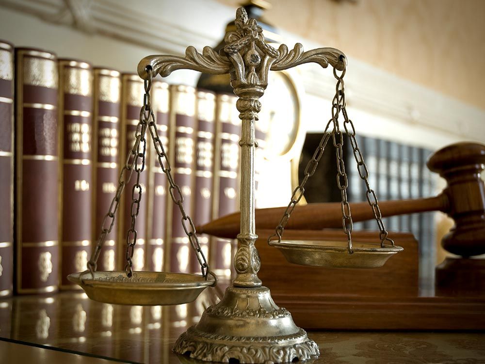 Lawyer's scale and gavel on a desk, representing Todd East Attorney at Law, Automobile Accidents Att