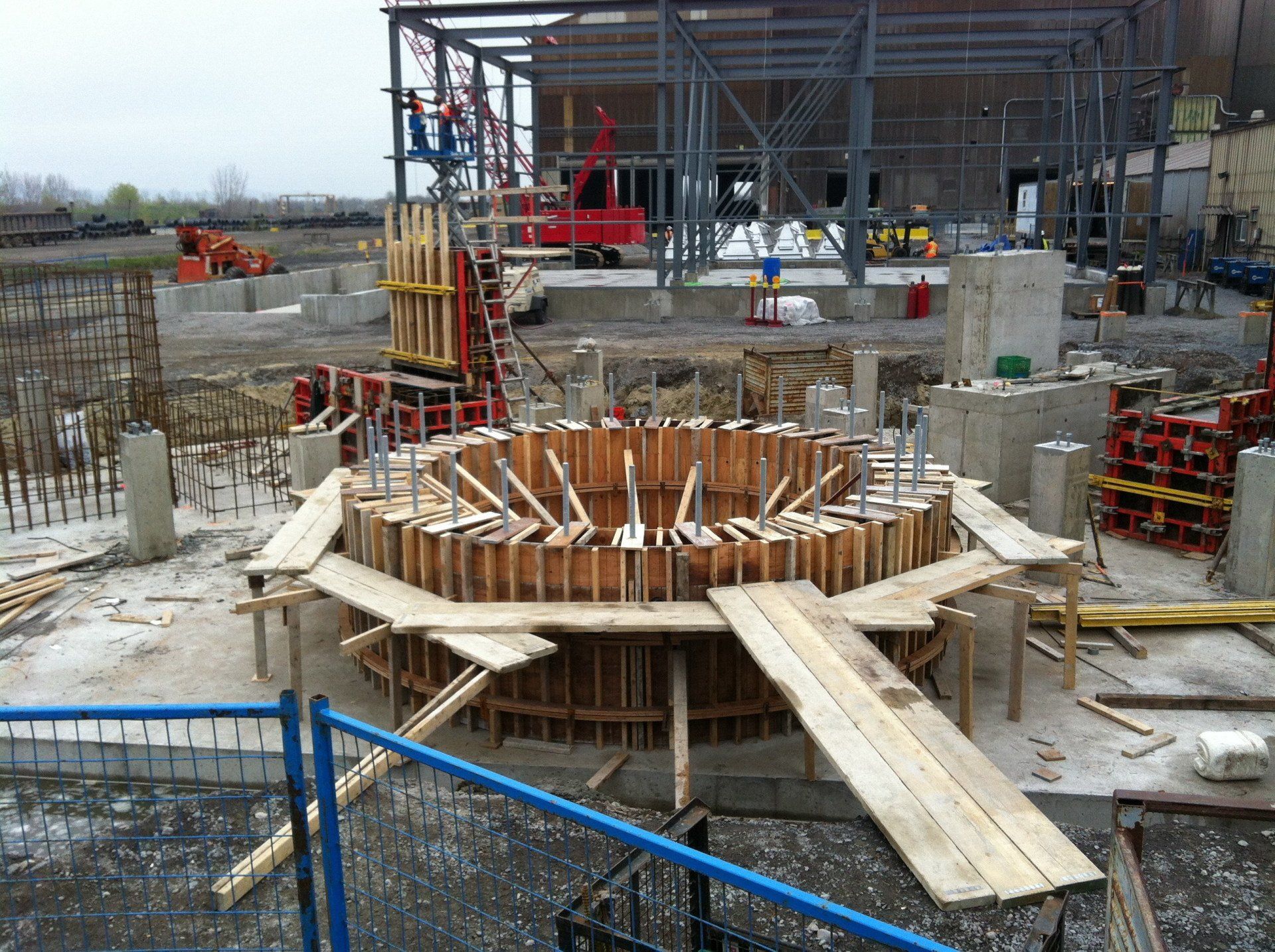 A construction site with a circular structure being built