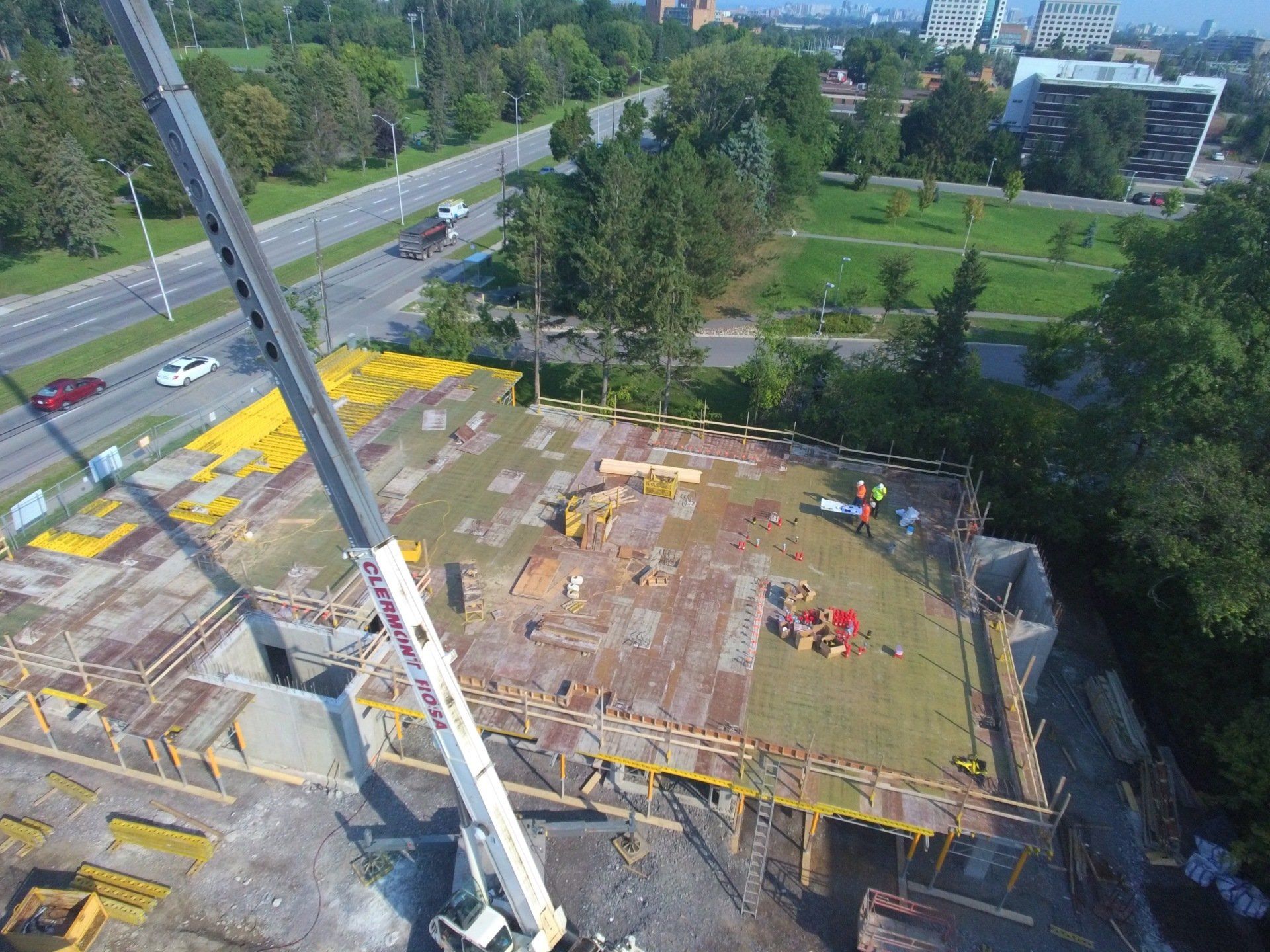 An aerial view of a construction site with a crane.