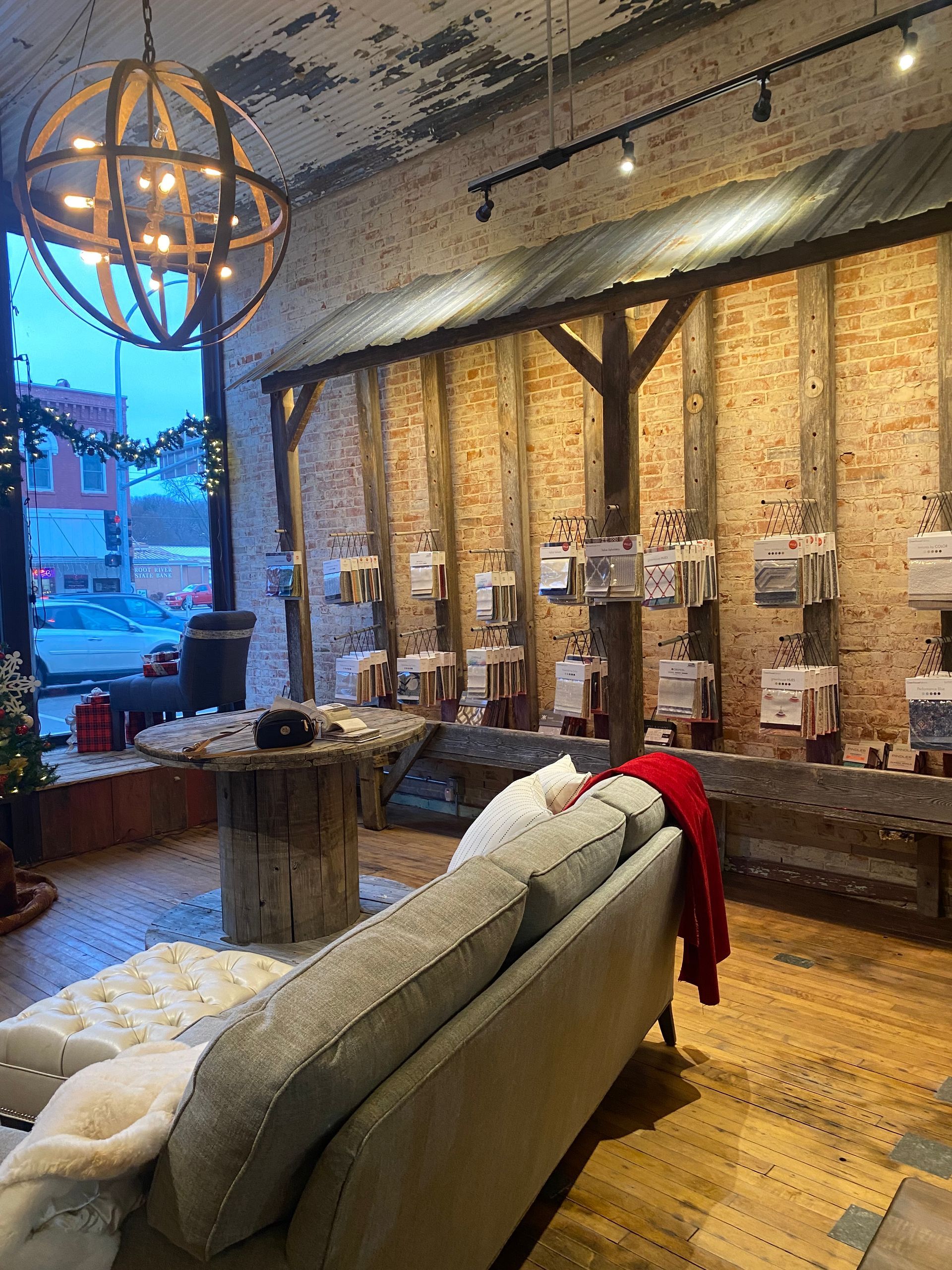 A living room with a couch and a table in a store.