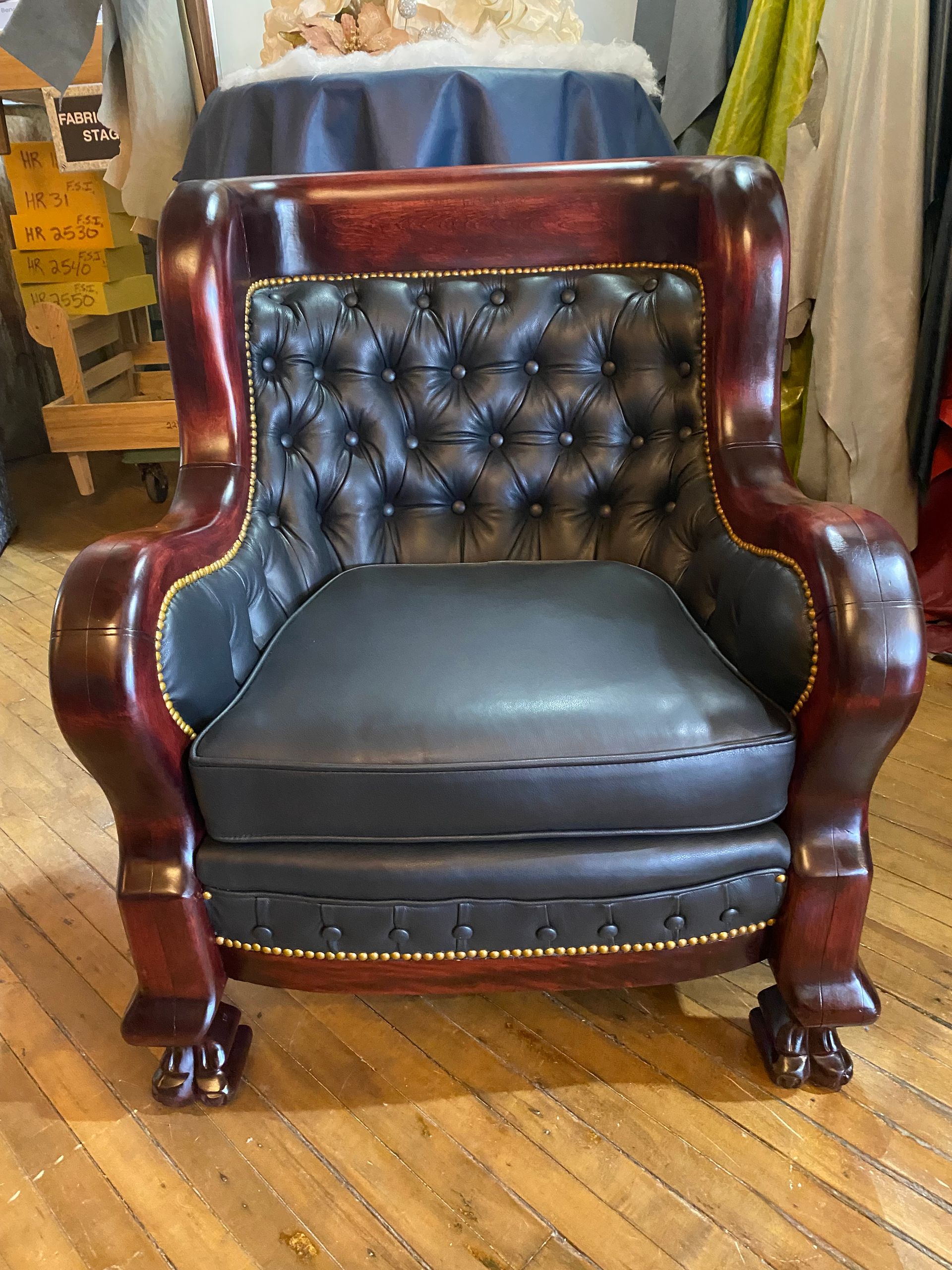 Black leather tufted back chair