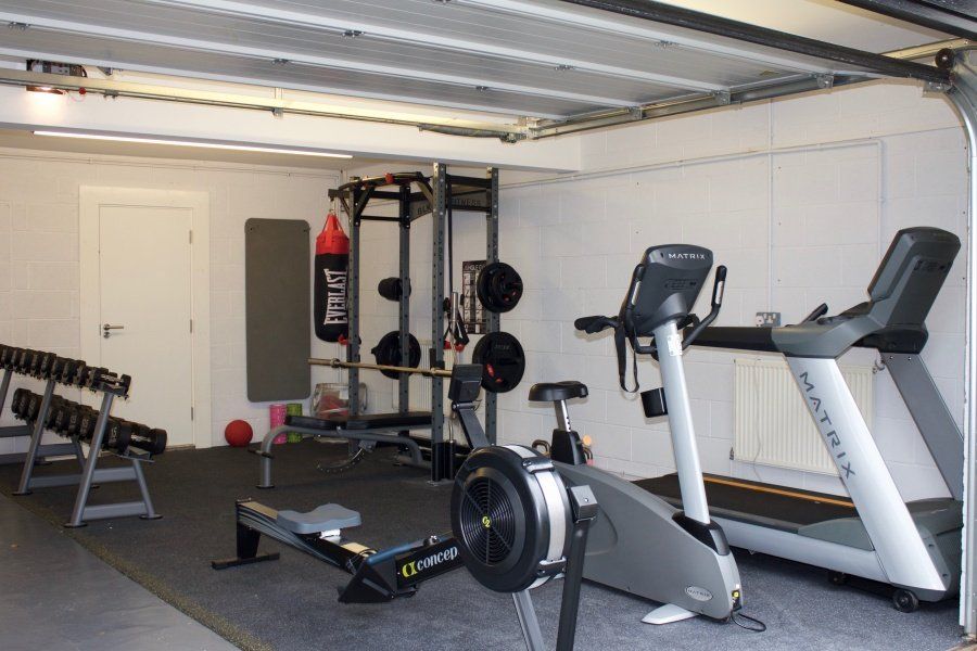 This garage has been converted into a Home Gym Space