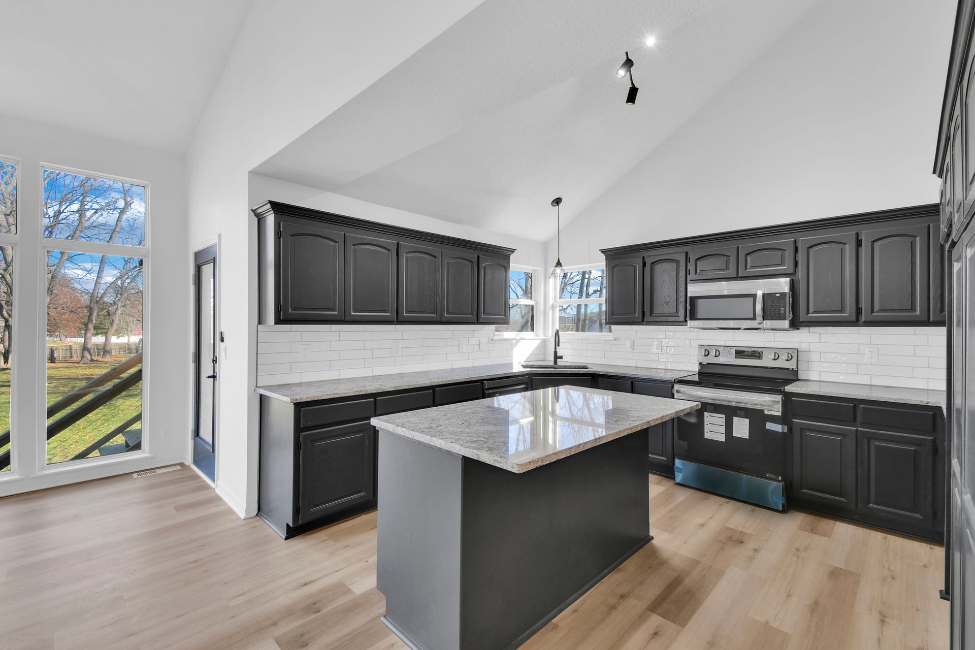 There is a large island in the middle of the kitchen.